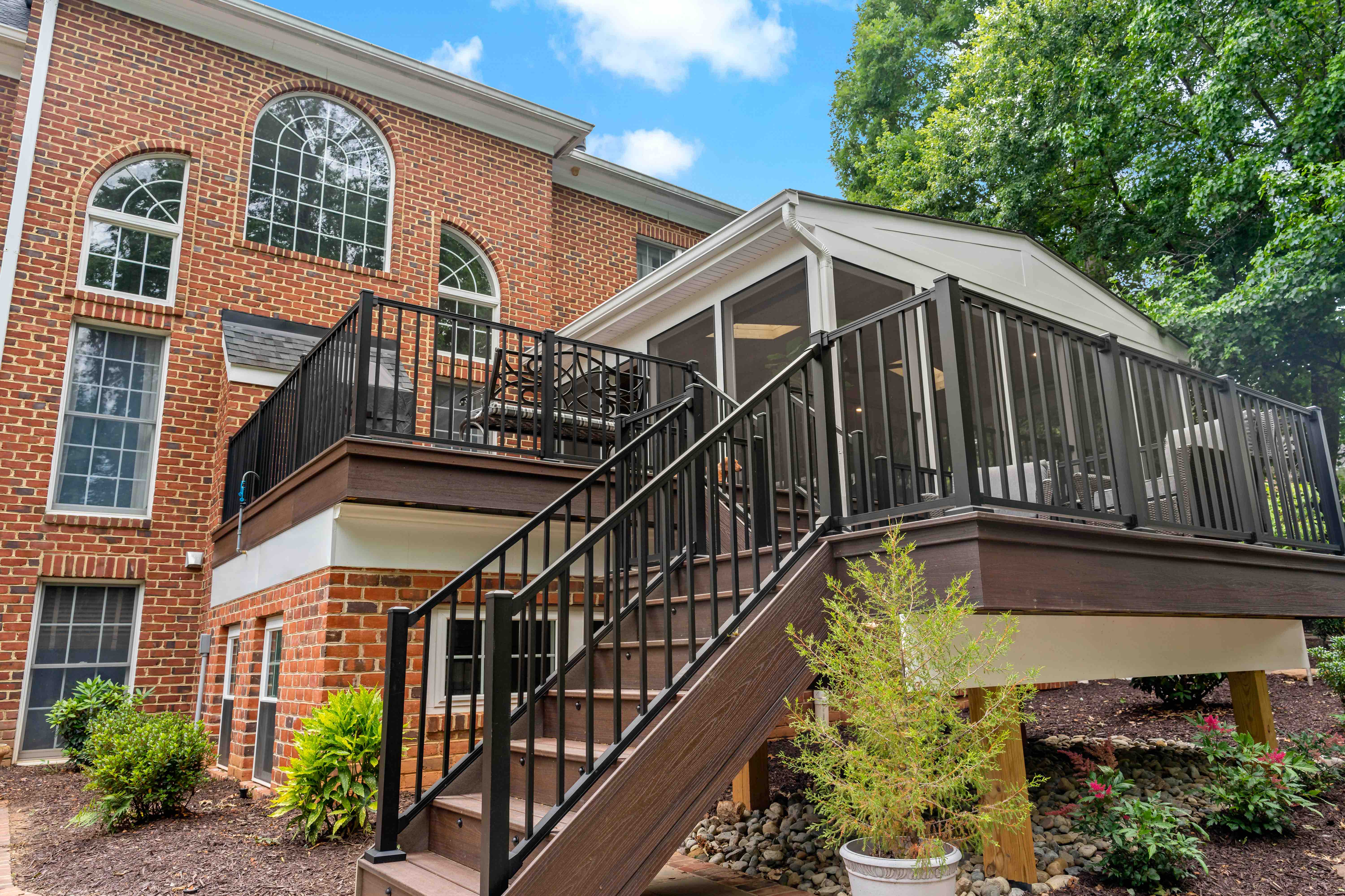 Exterior view of screened porch addition in Oakton with stairs