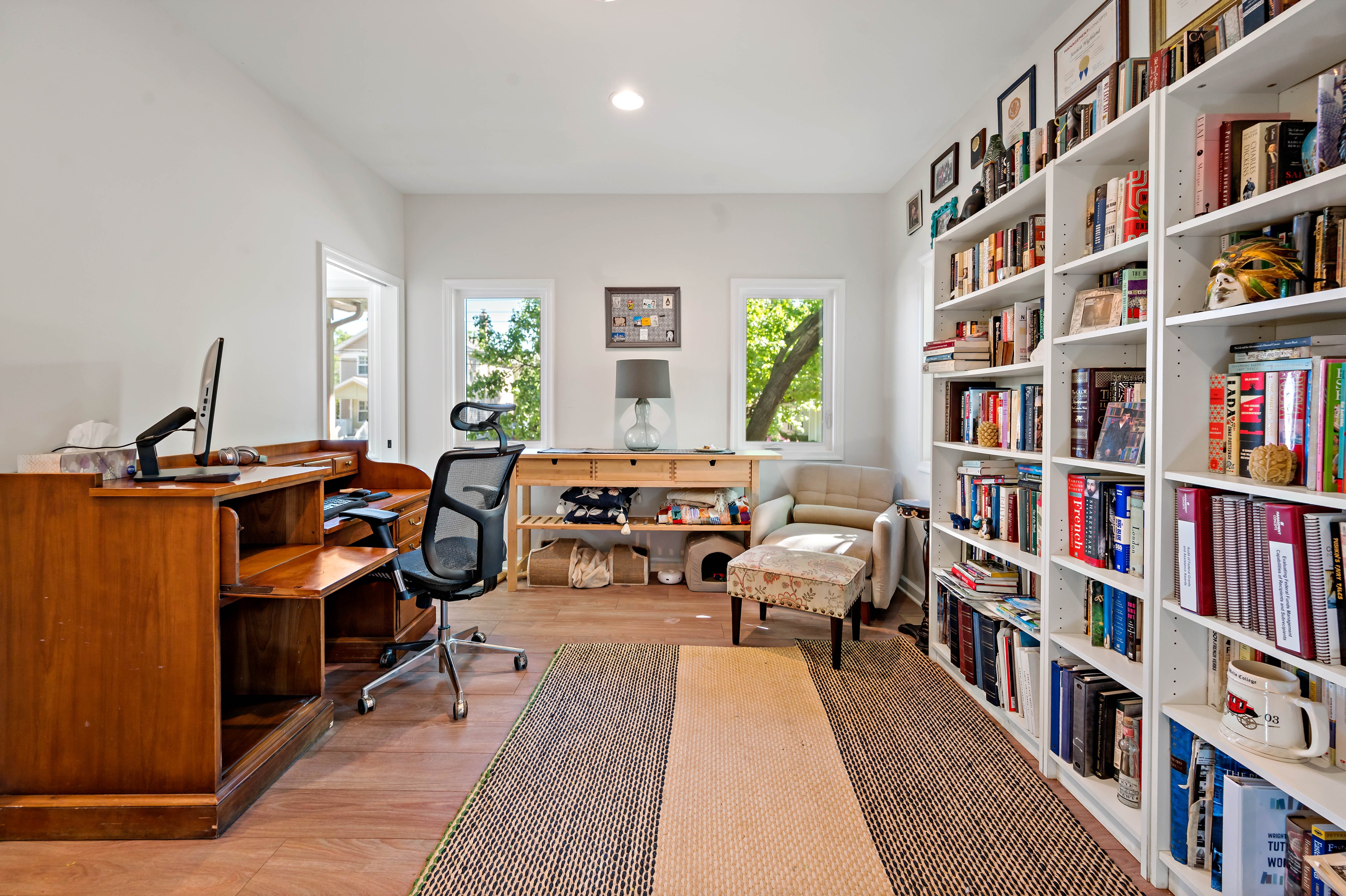 Home Office Addition with bookcase on entire wall