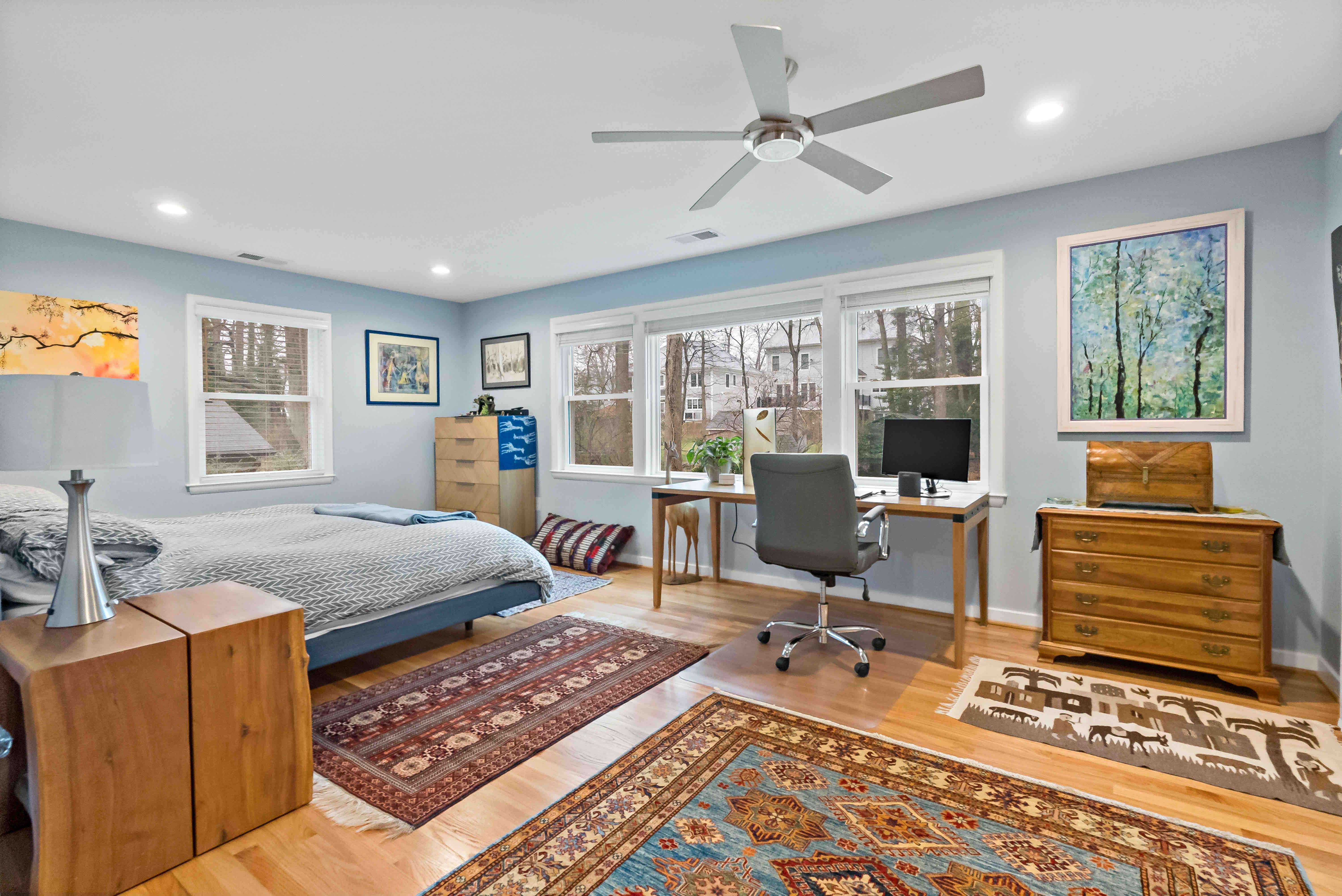 Bedroom with office space overlooking backyard