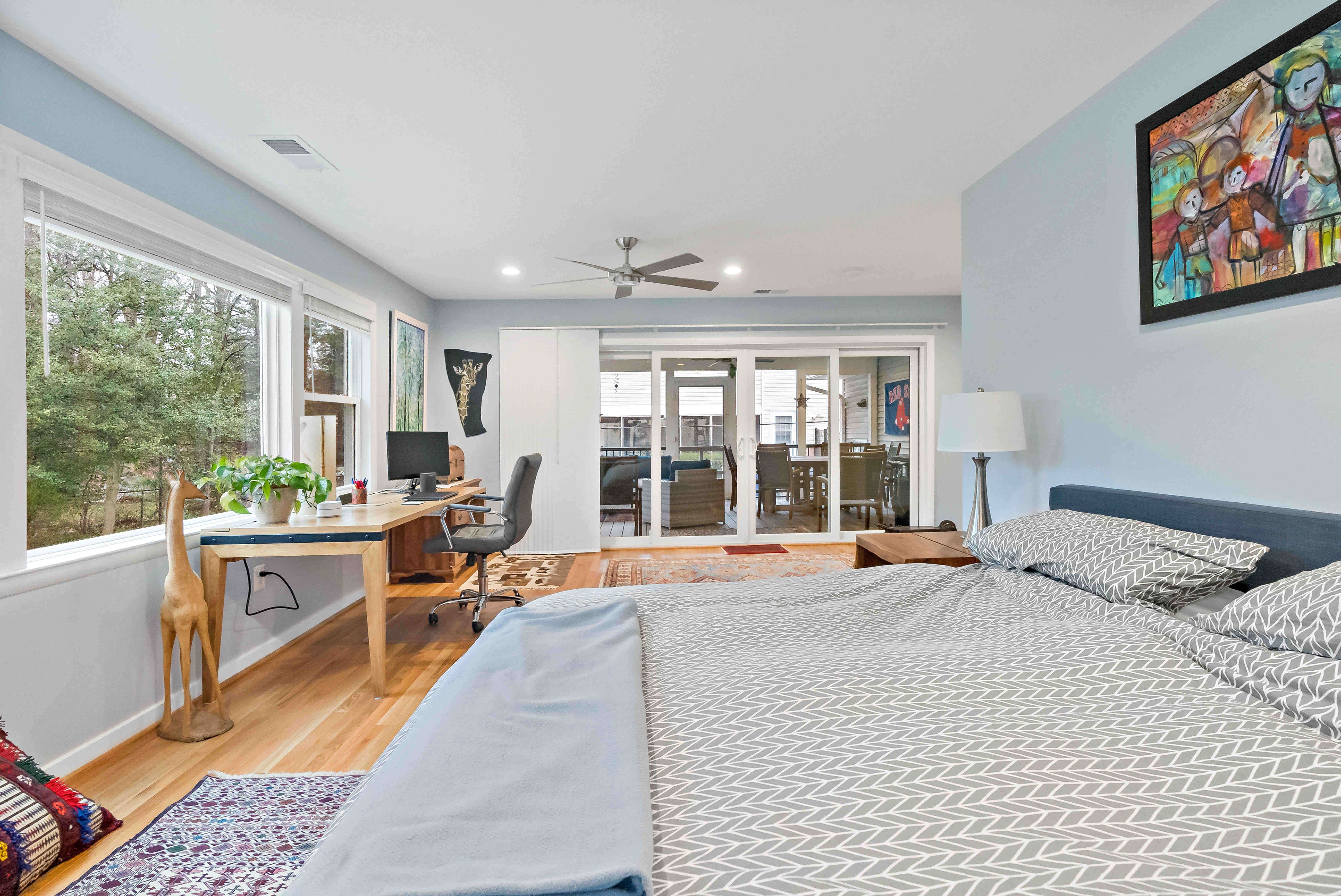 Bedroom with sliding door leading to screened porch