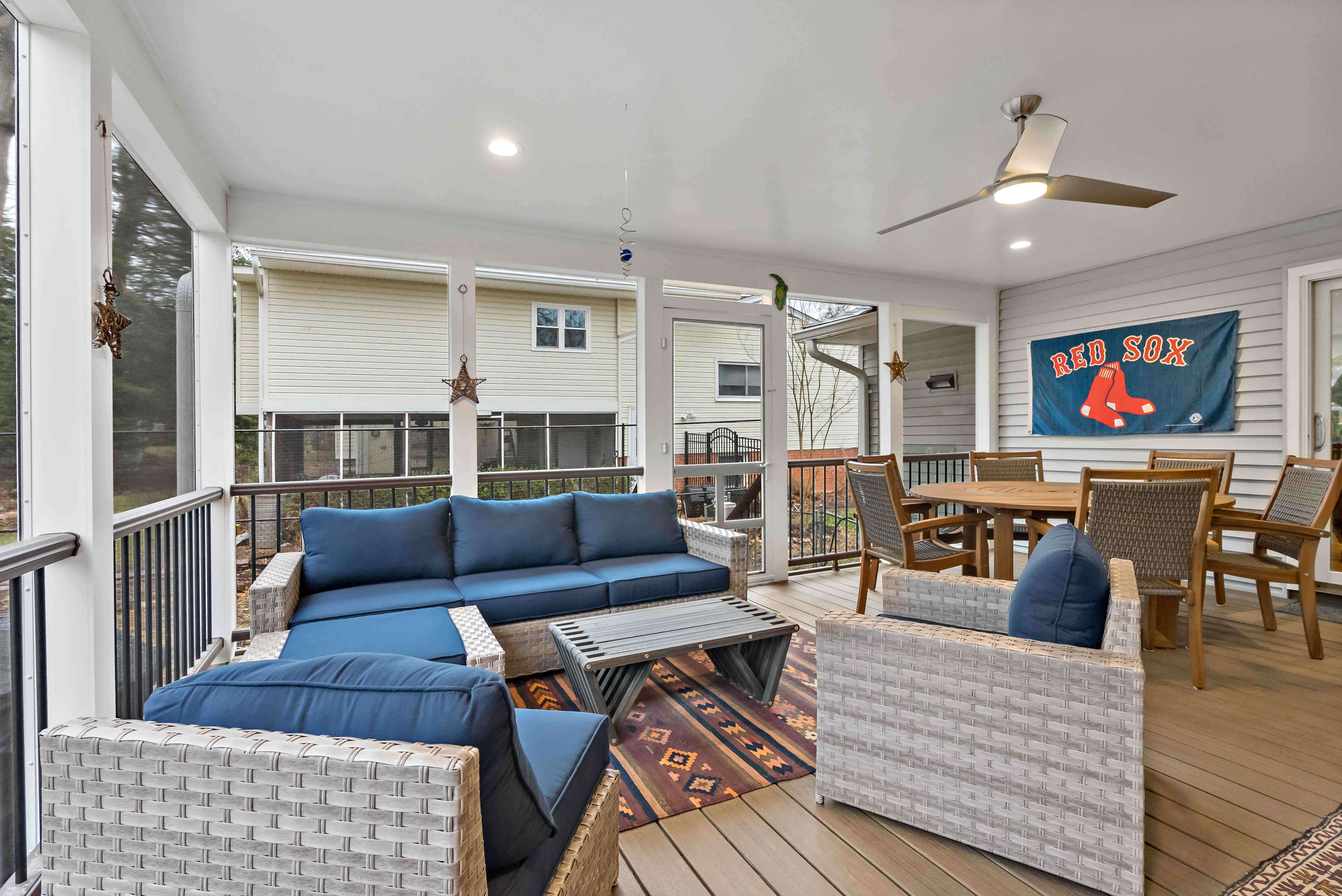 Furnished screened porch with wood flooring