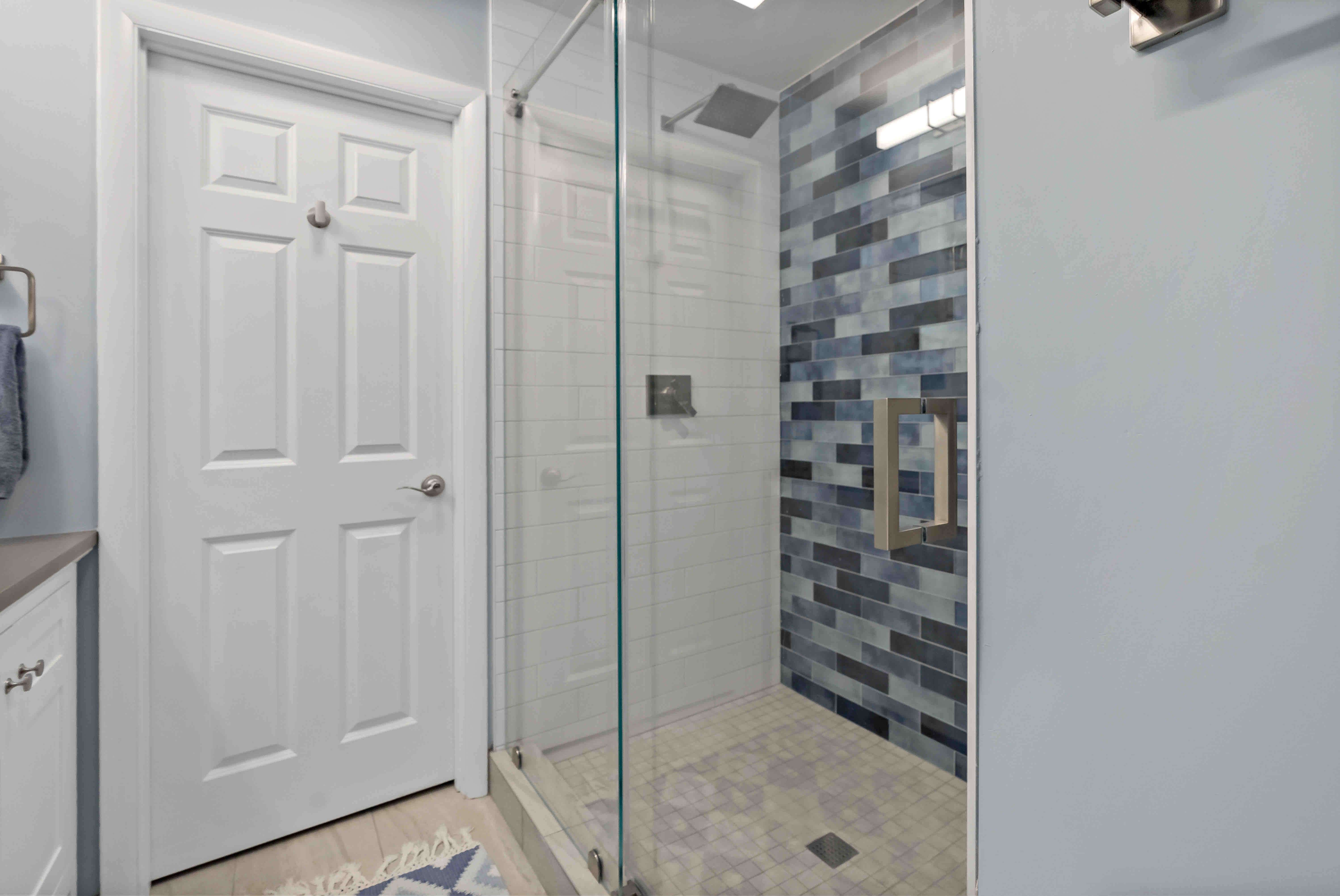 Stand up shower with glass walls and door