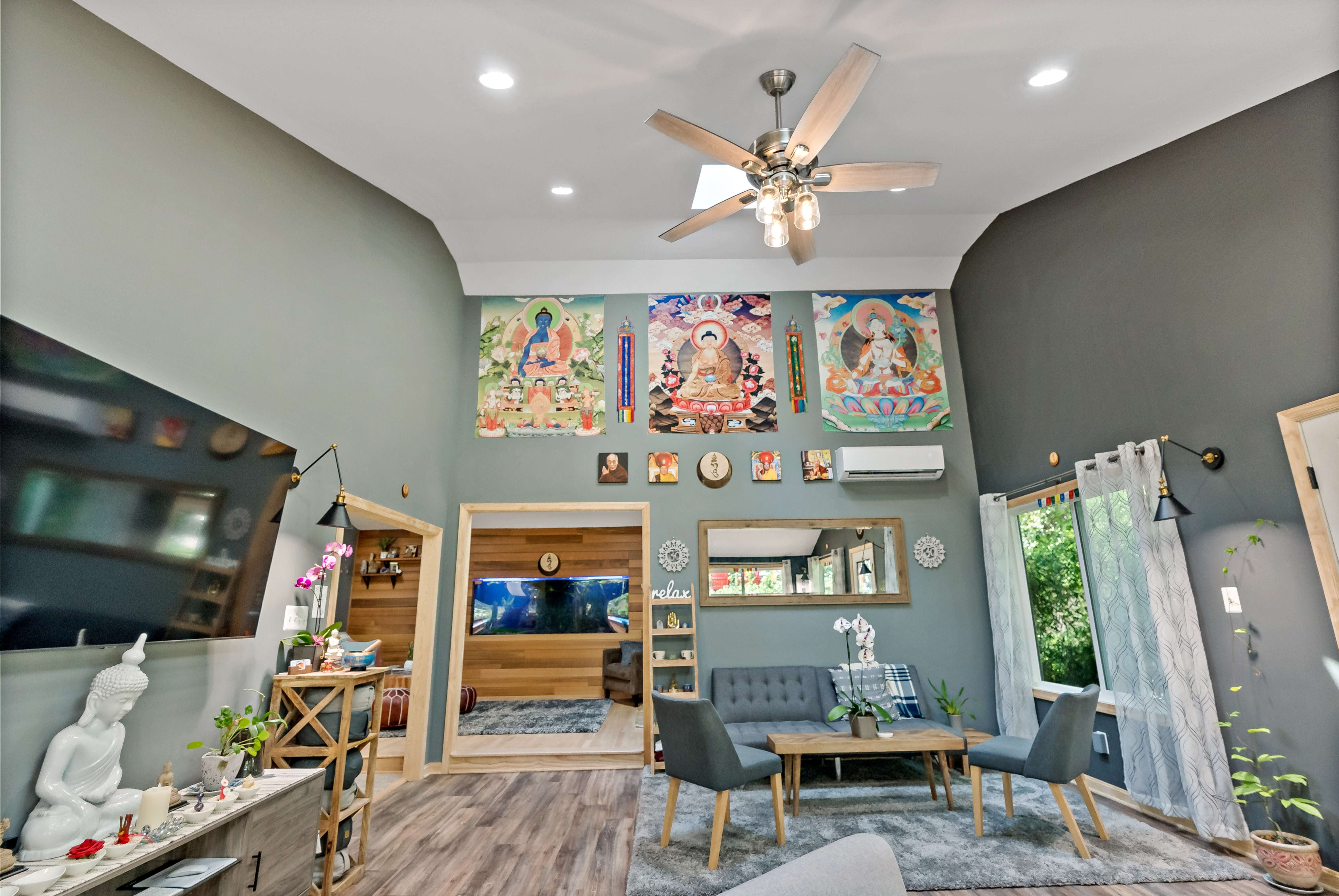 Slanted ceiling with ceiling fan in meditation center