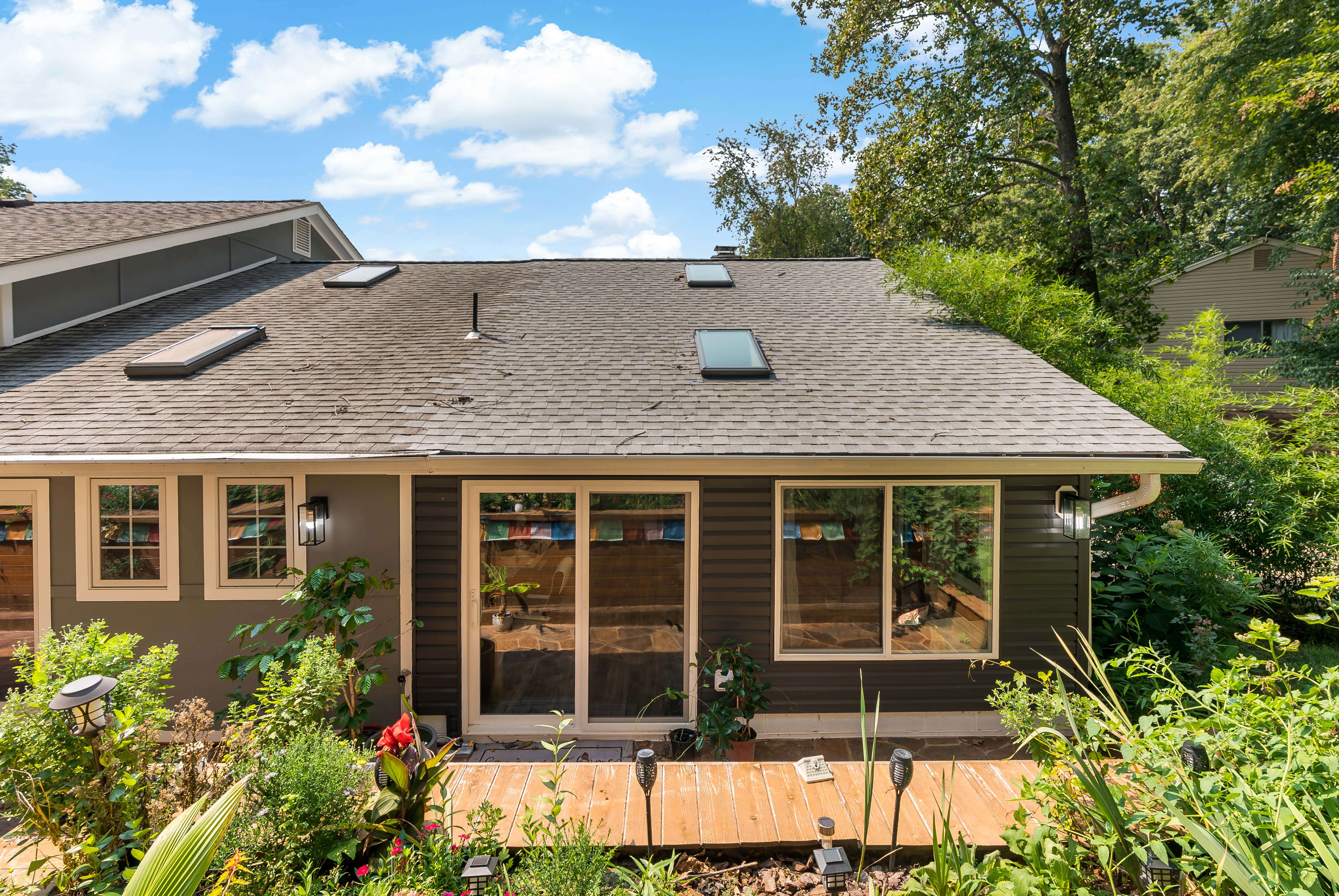 Back of home with large windows
