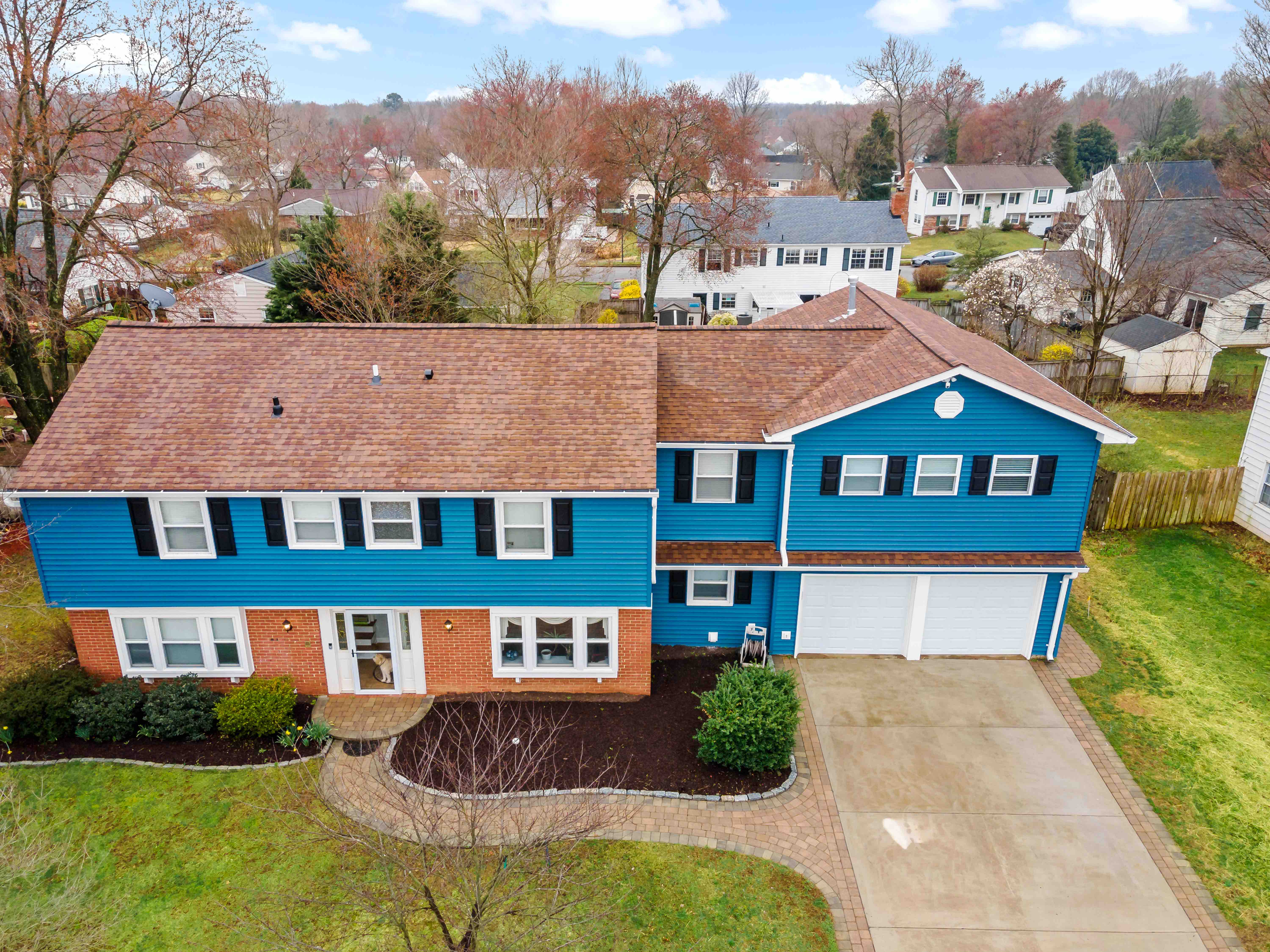 Bright blue over garage apartment addition