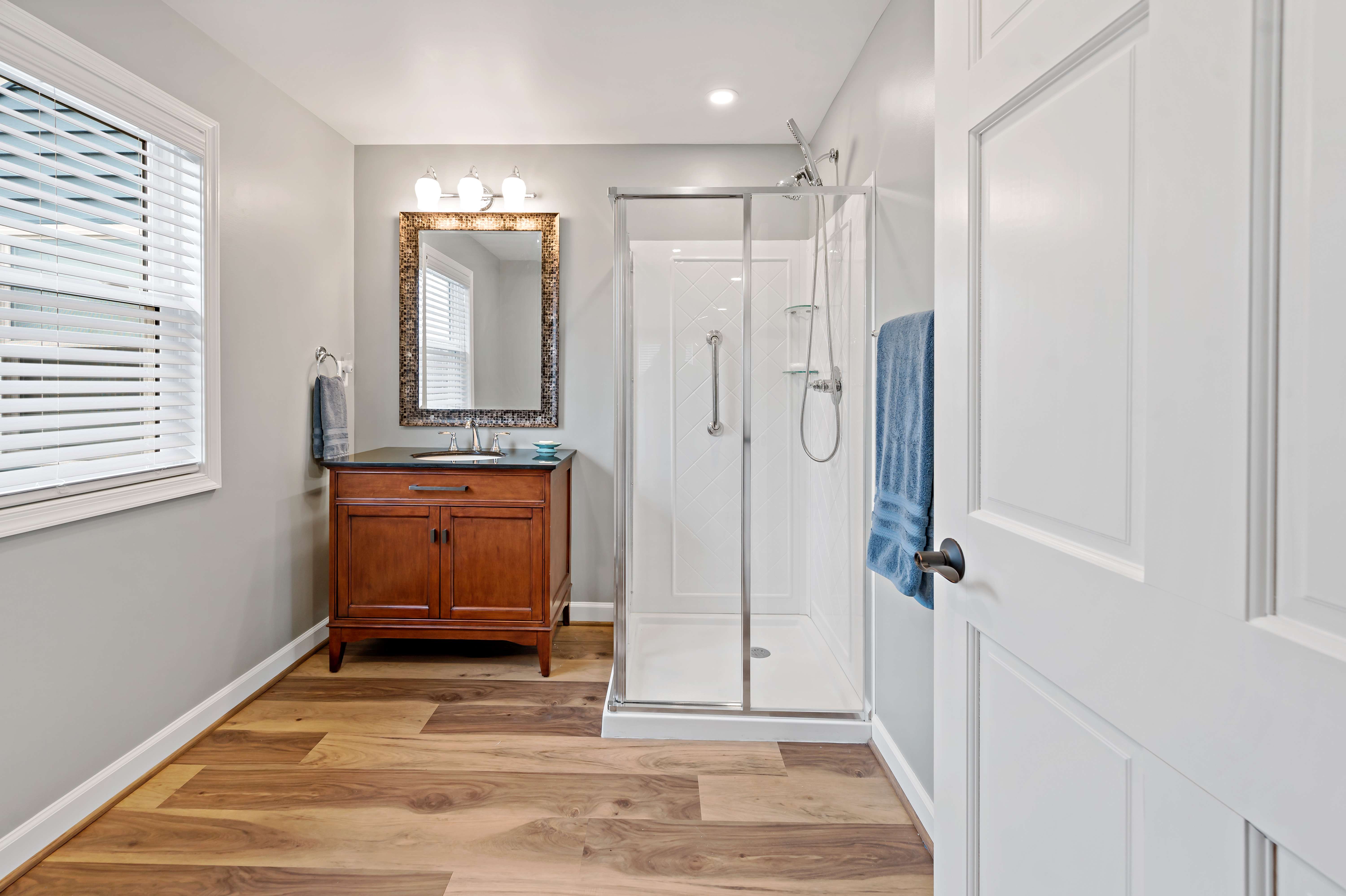 Bathroom with small stand-up shower