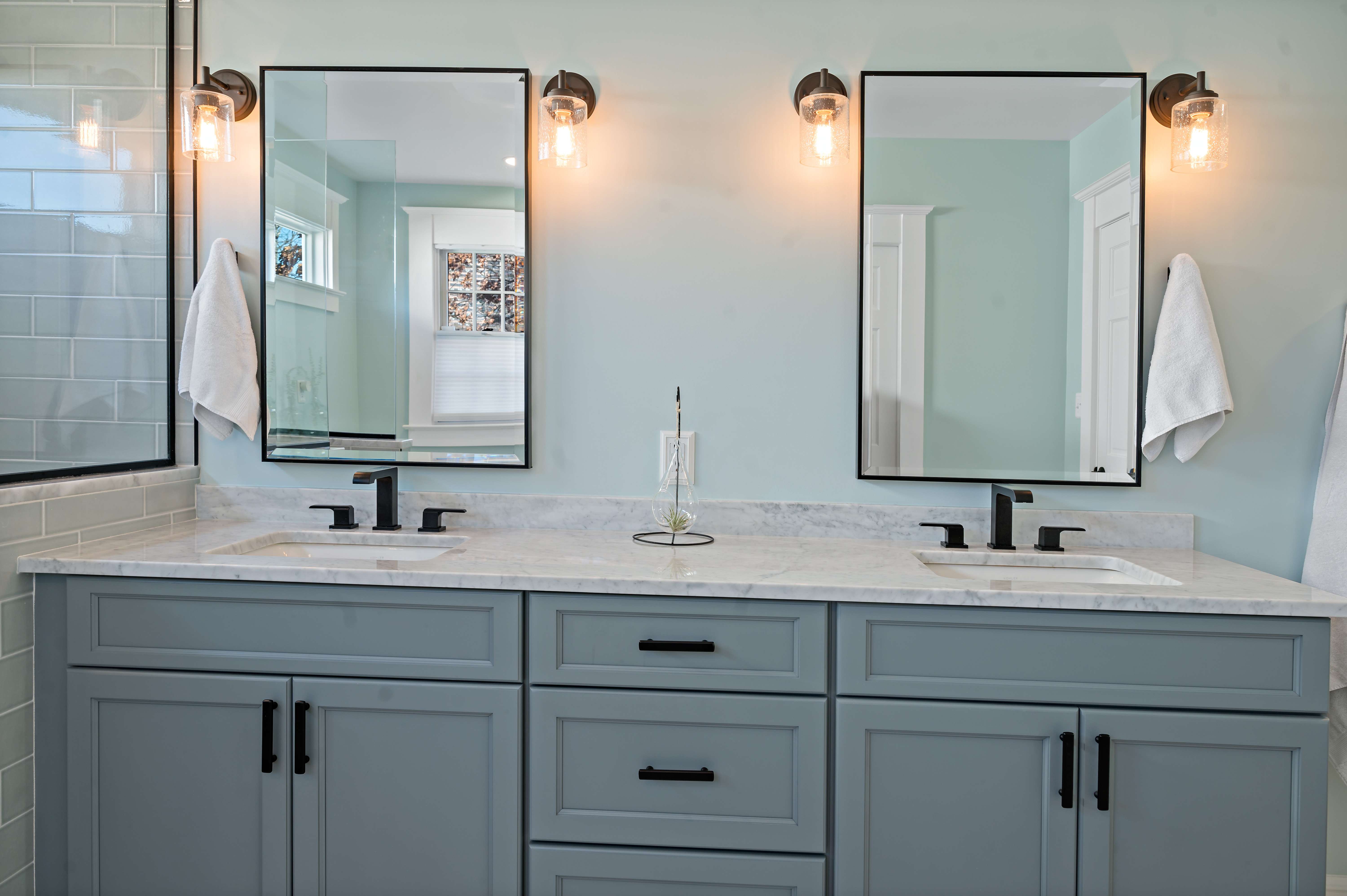Blue grey double vanity and double sink in bathroom