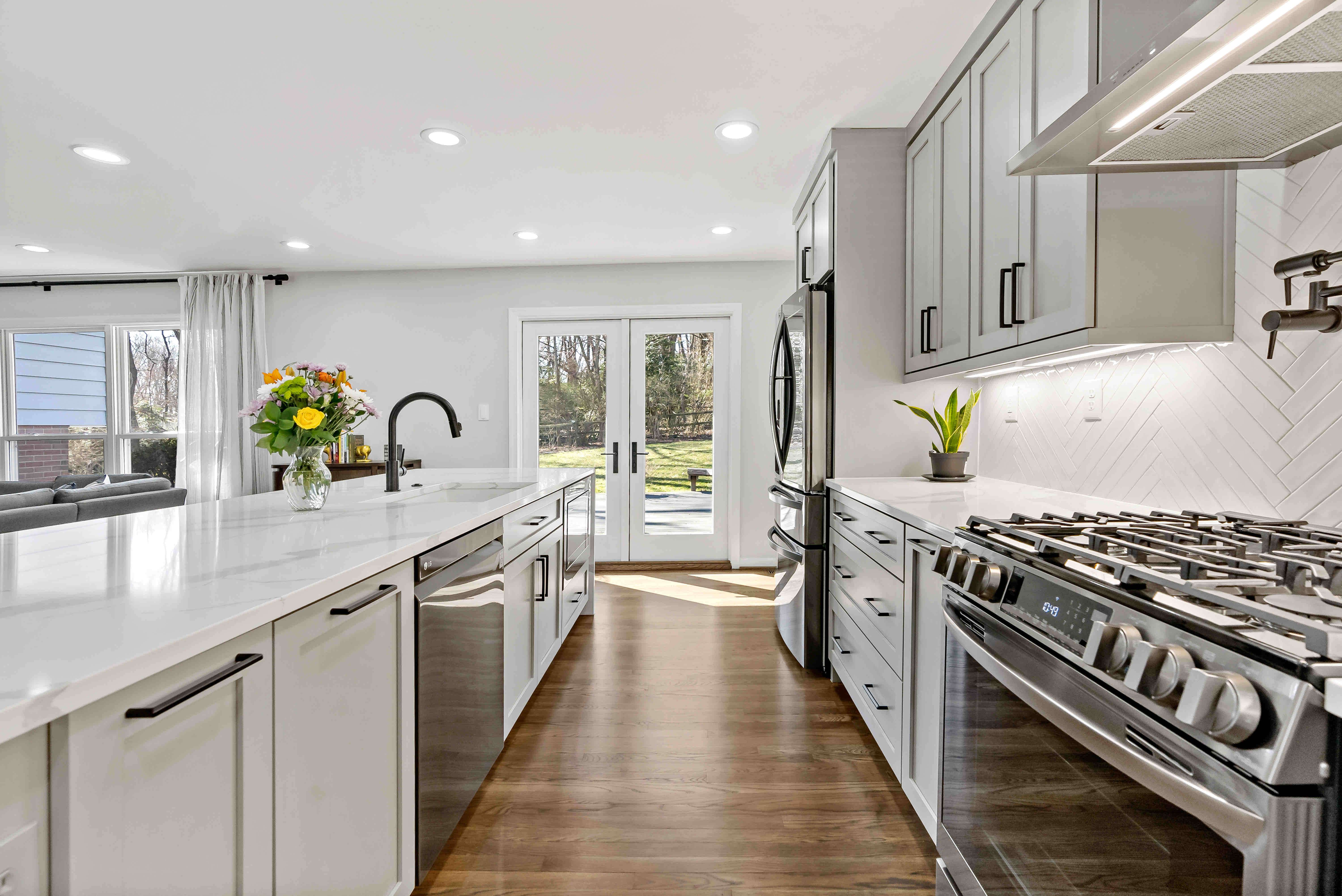 White kitchen with hard wood floors
