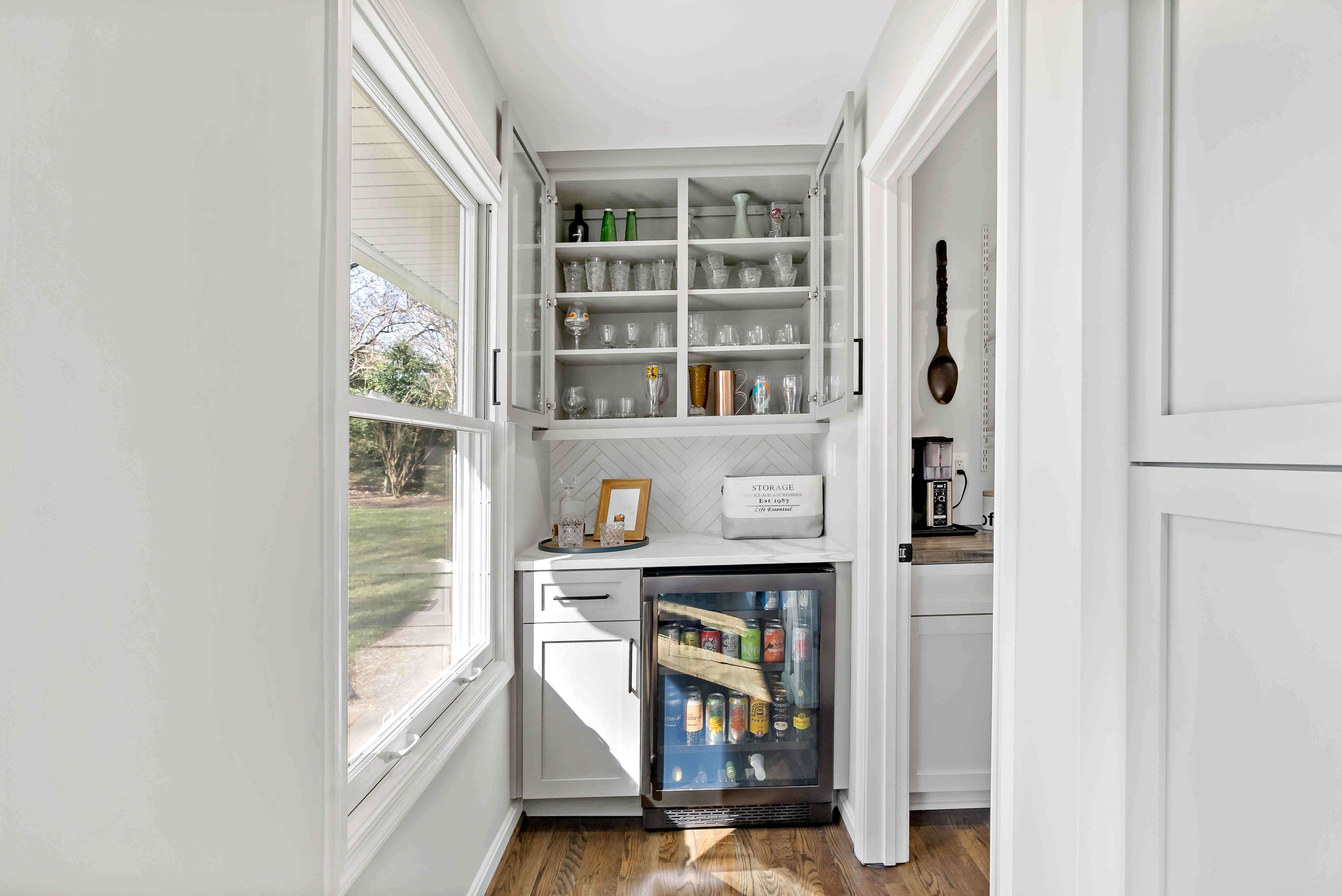 Glass cabinet drink and glasses display with cooler at bar