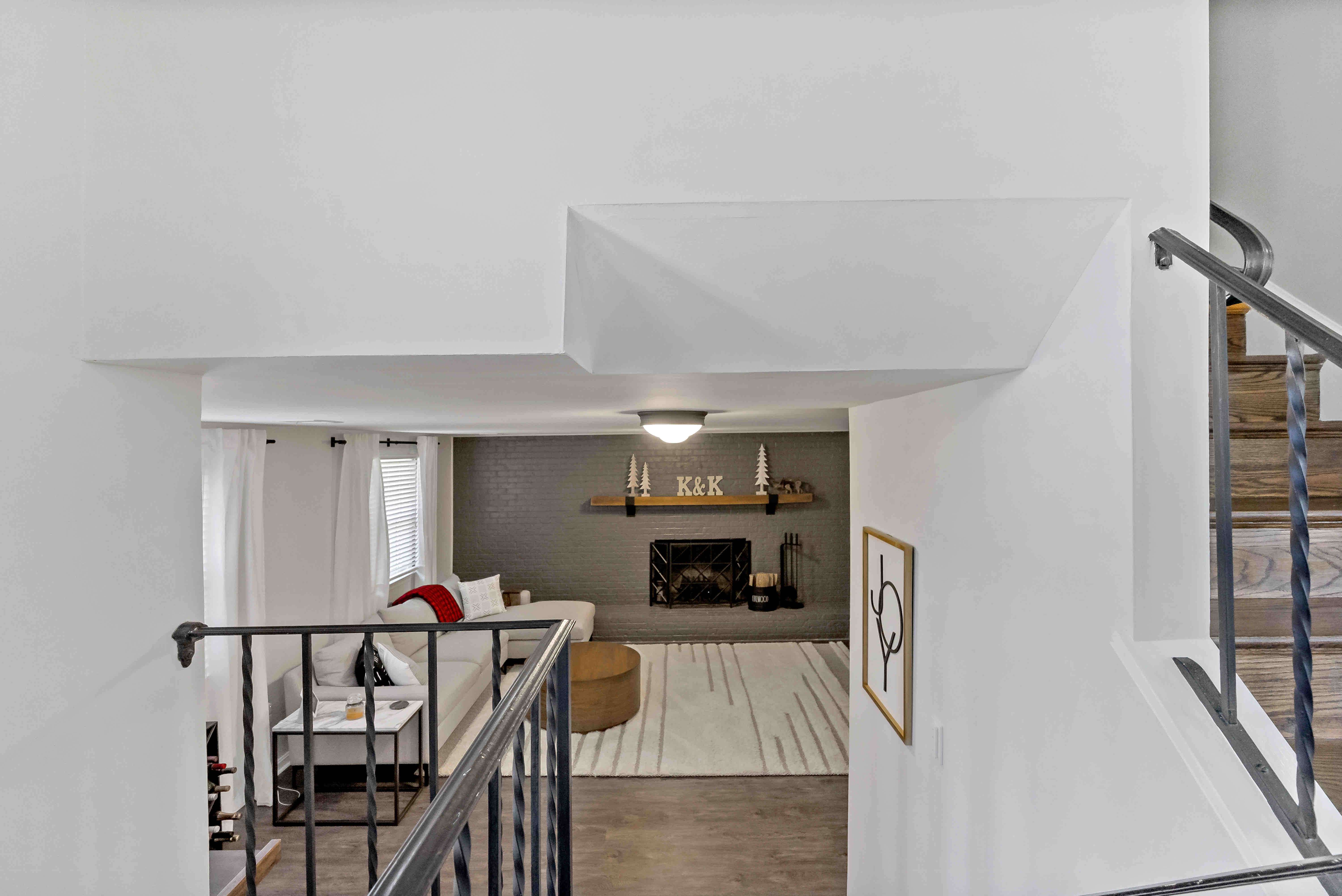 Upstairs view from staircase with metal railing detail