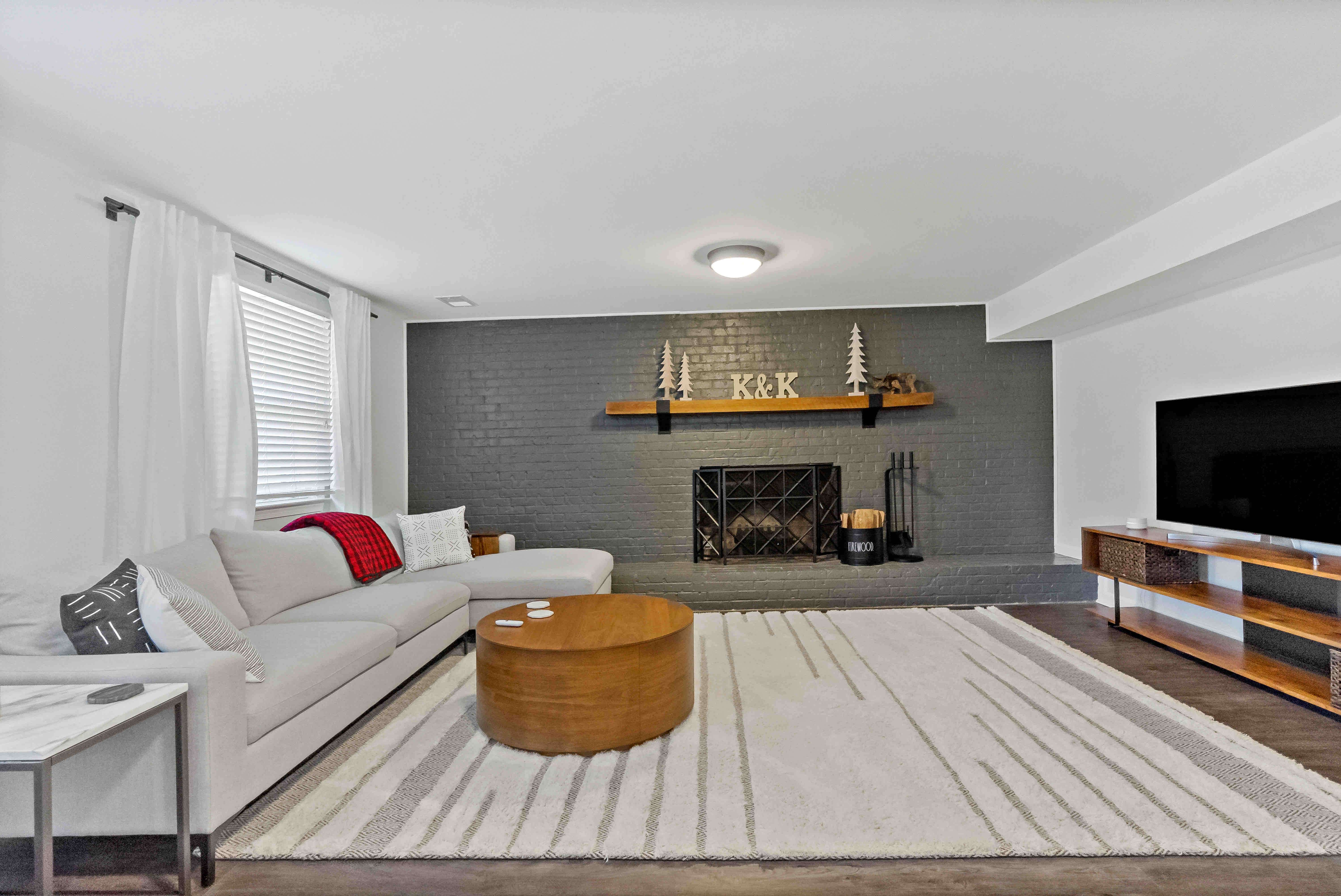 Living room with fireplace and area rug