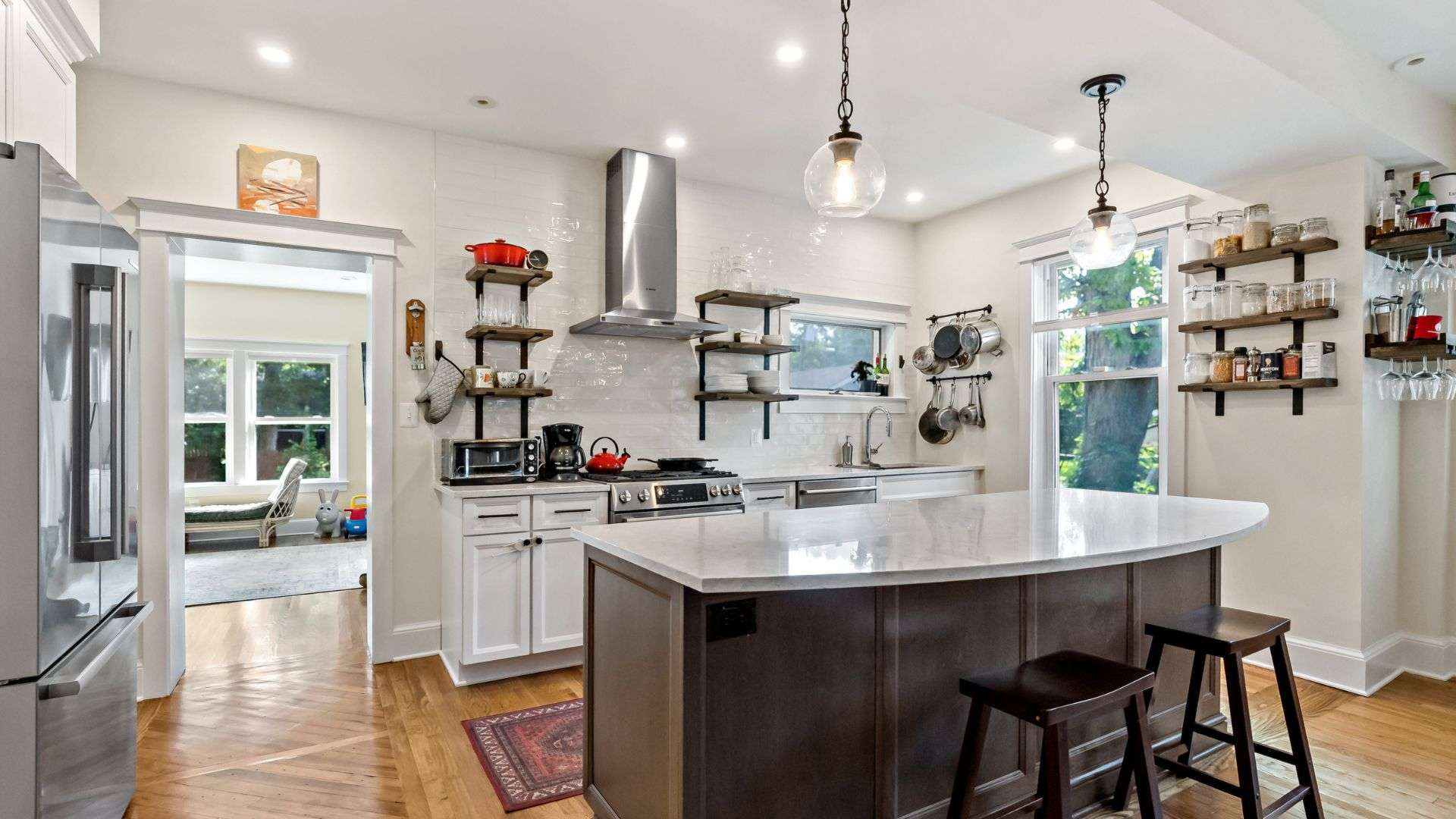 Round pendant lighting above kitchen island