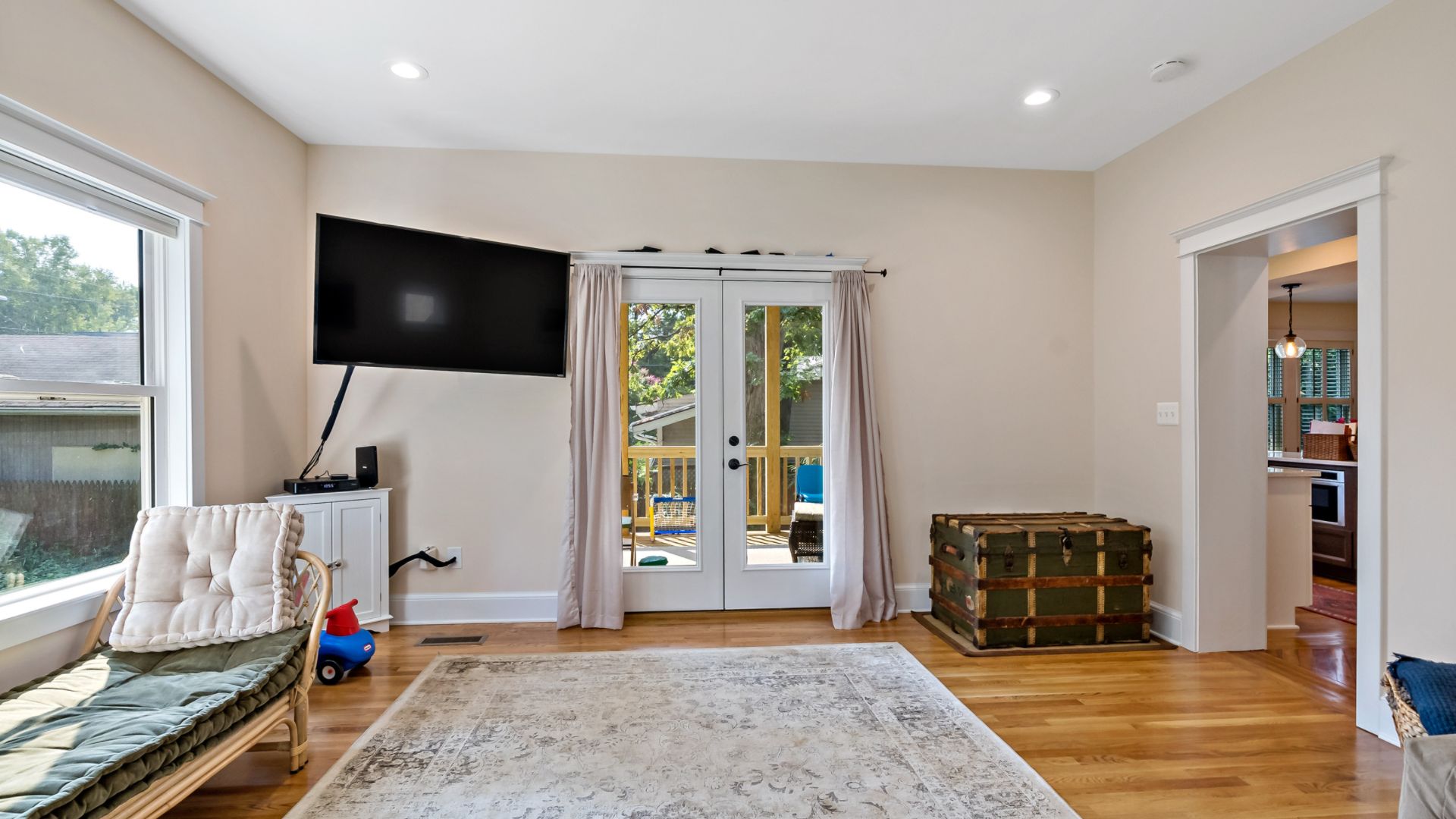 Living room with door access to screened porch