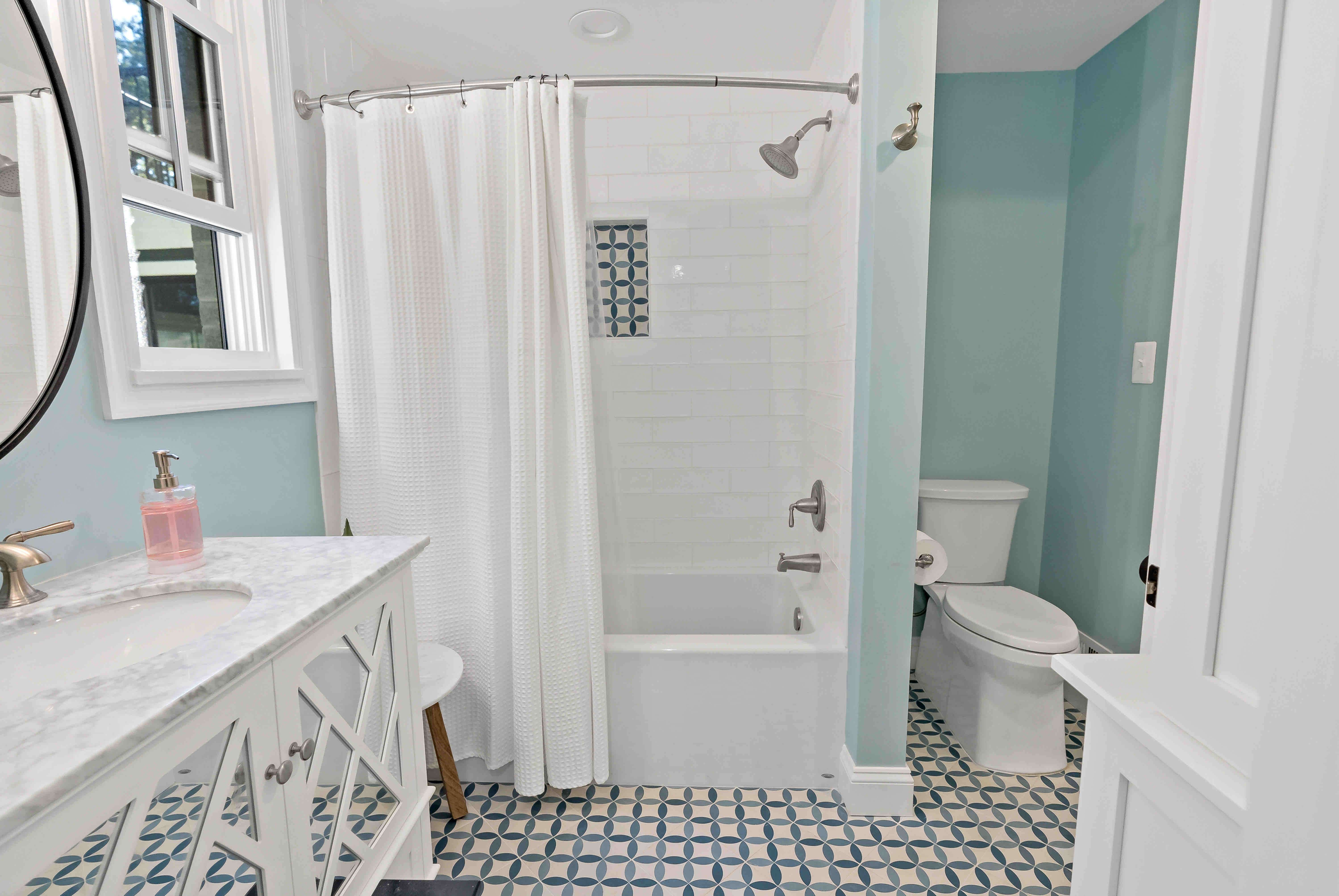 Shower and bathtub combo with checkered floor tile