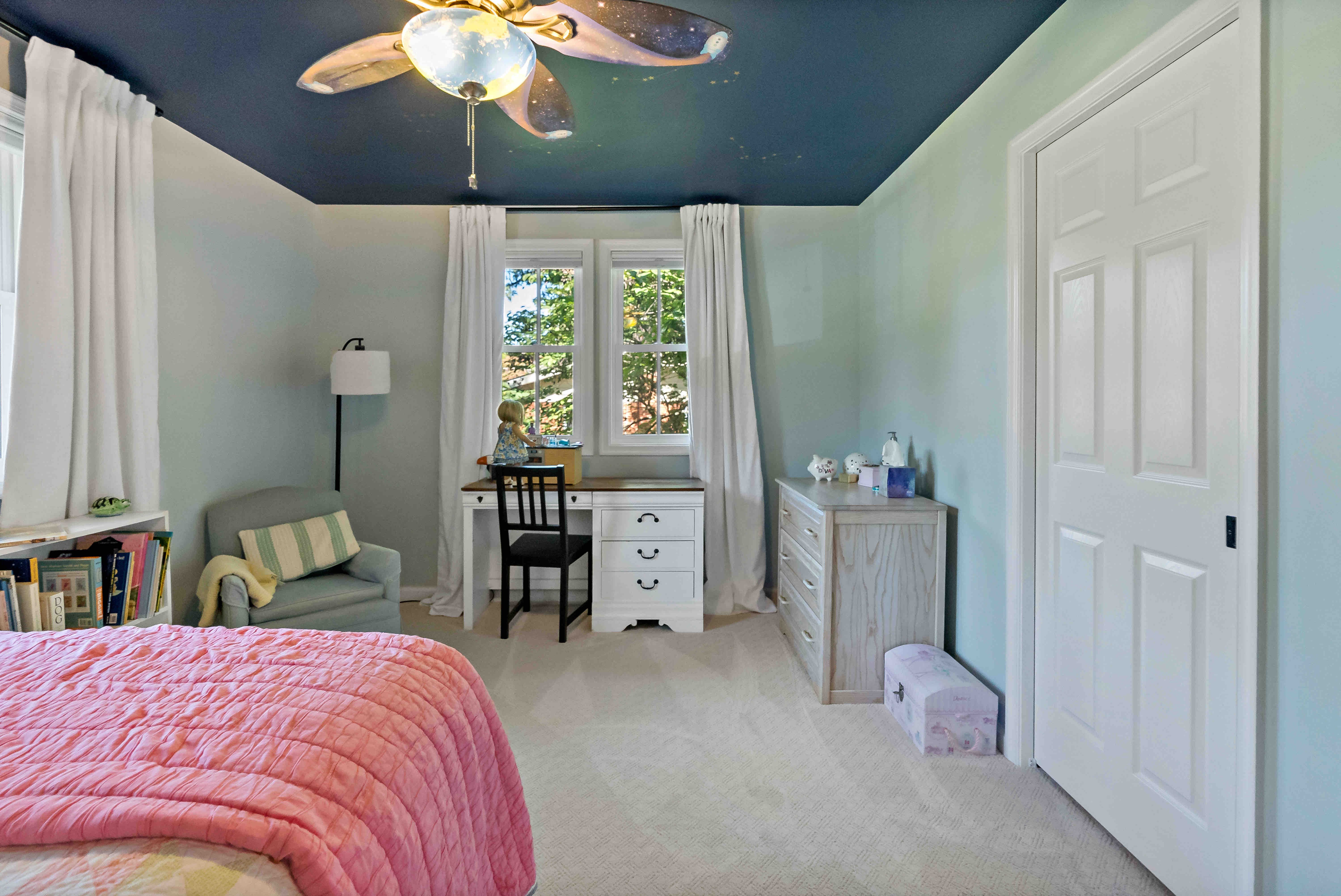 Bedroom with window treatment