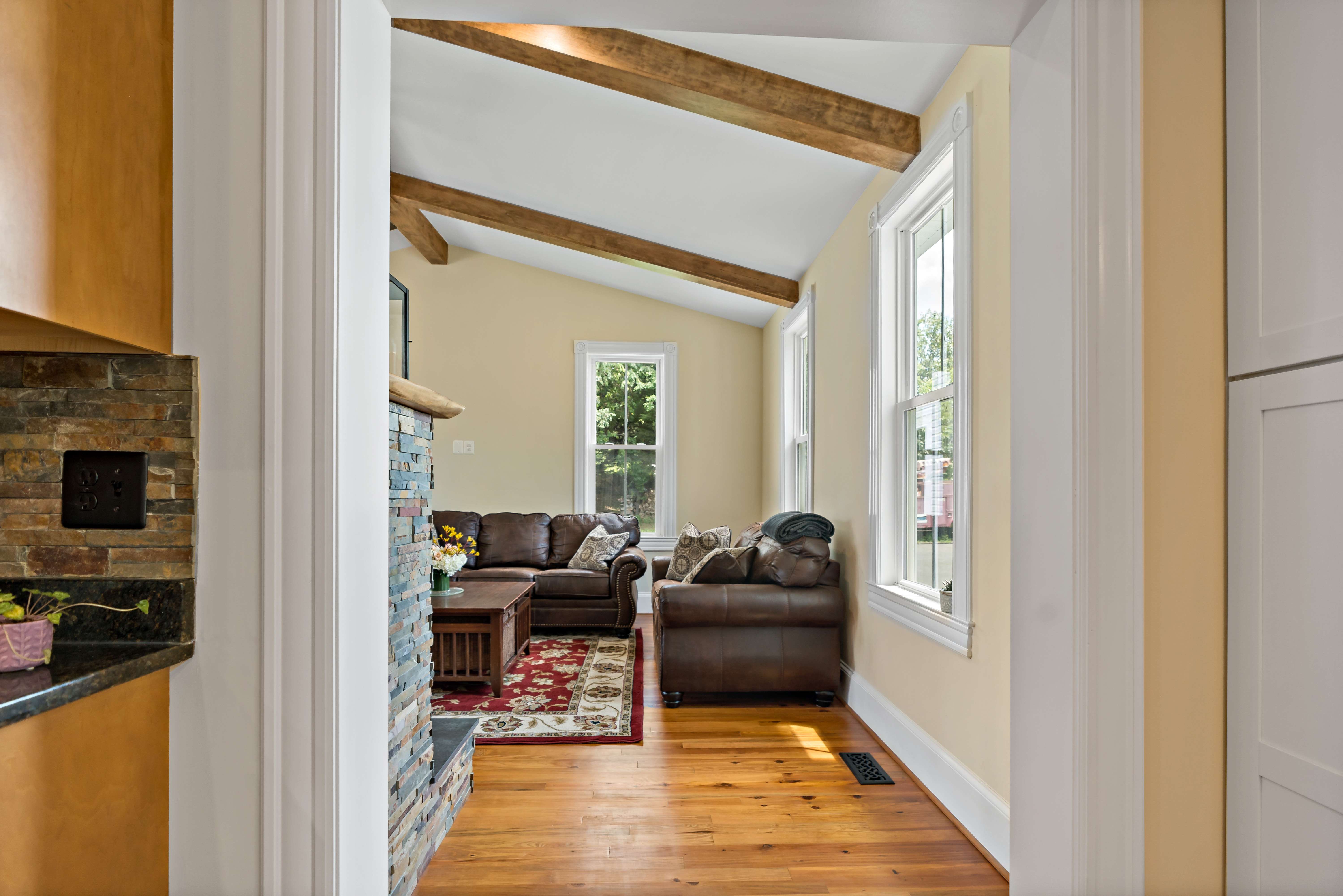 Exposed wood beams with cathedral ceiling in historic Fairfax home