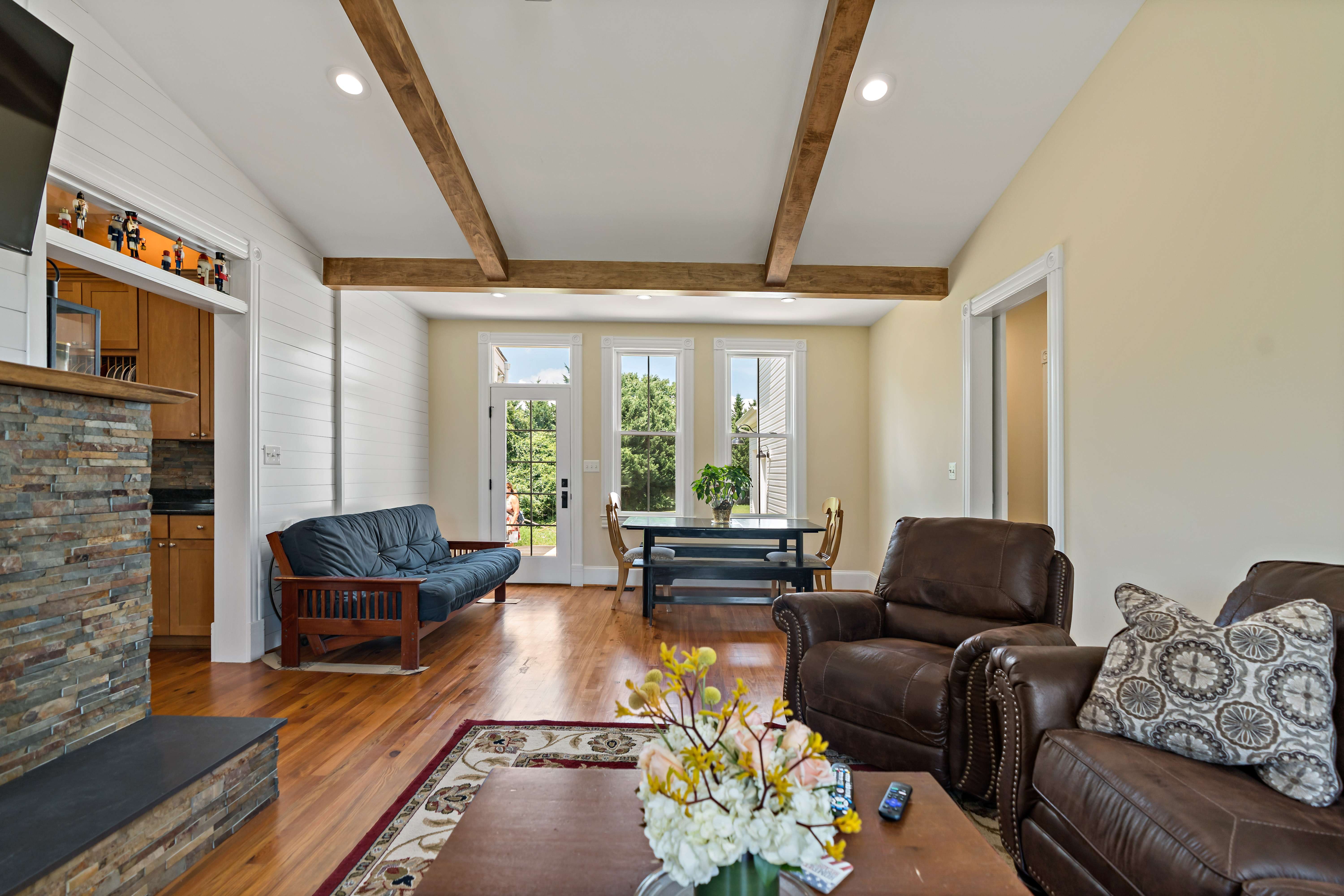Exposed wood beams on ceiling in living room