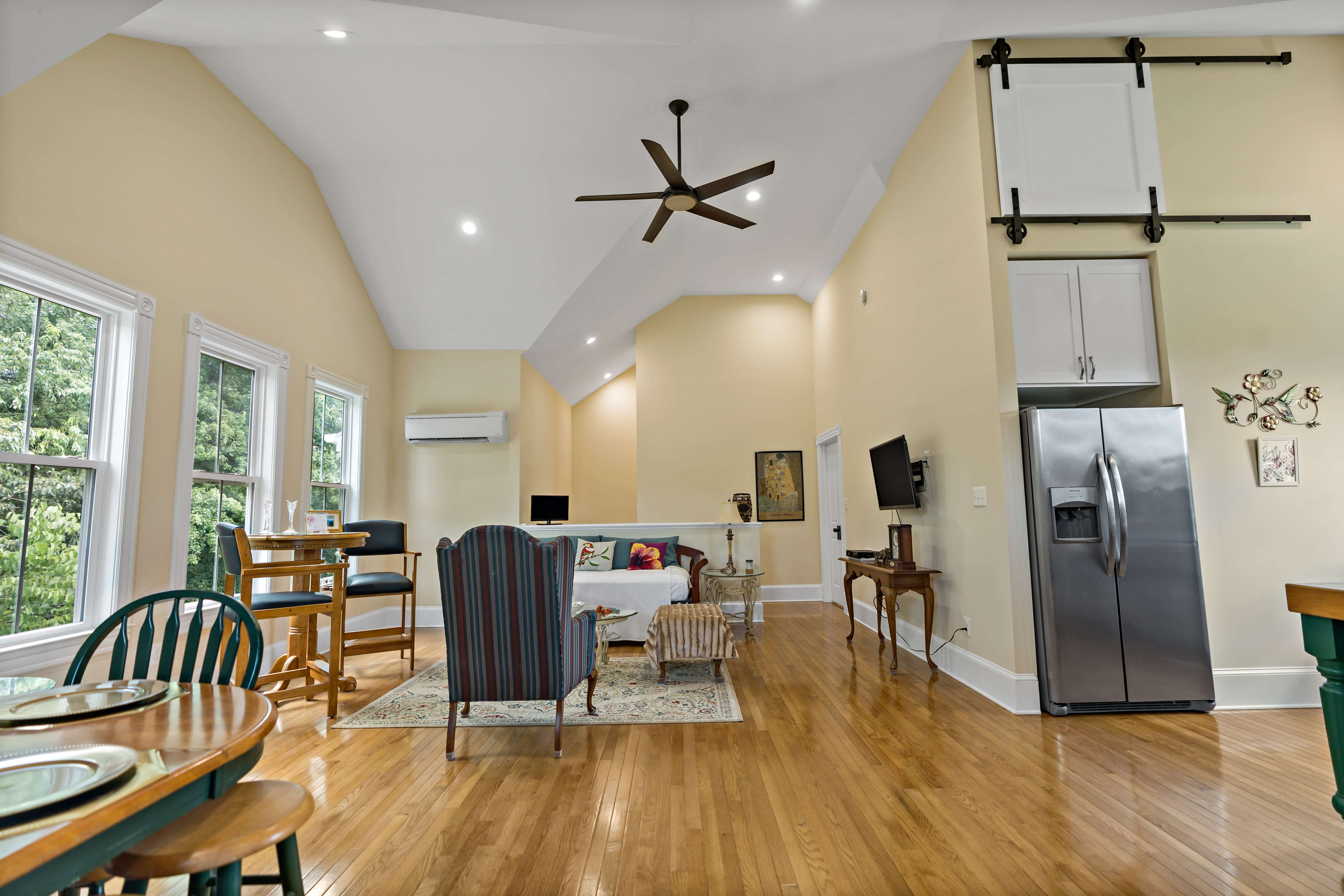 Tall ceilings in kitchen area with hard wood floors