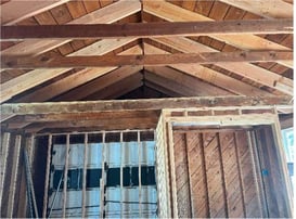 Wood beam foundational support inside garage
