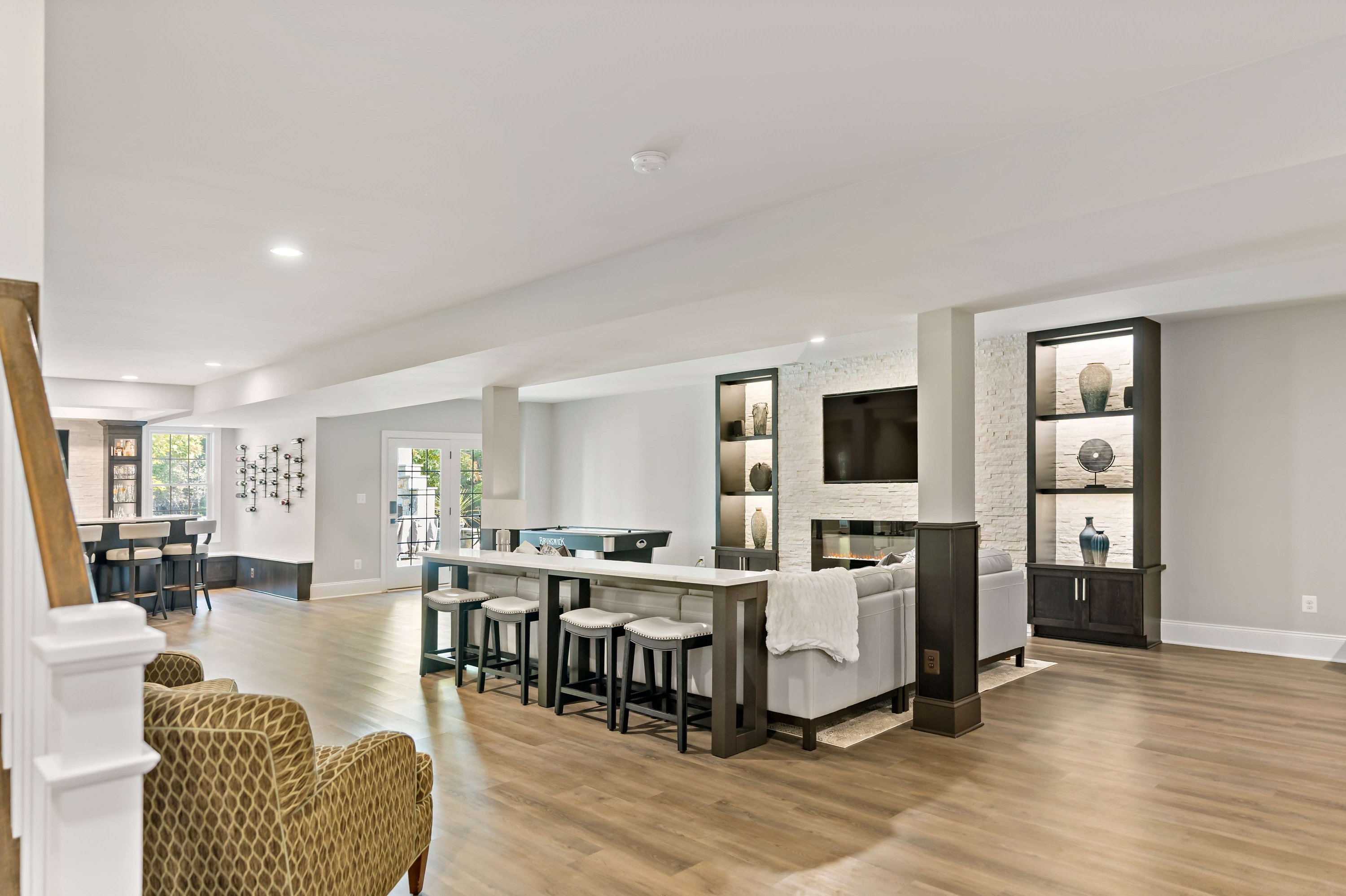 Stunning Haymarket Basement Remodel Showcases Welcoming Wet Bar and ...