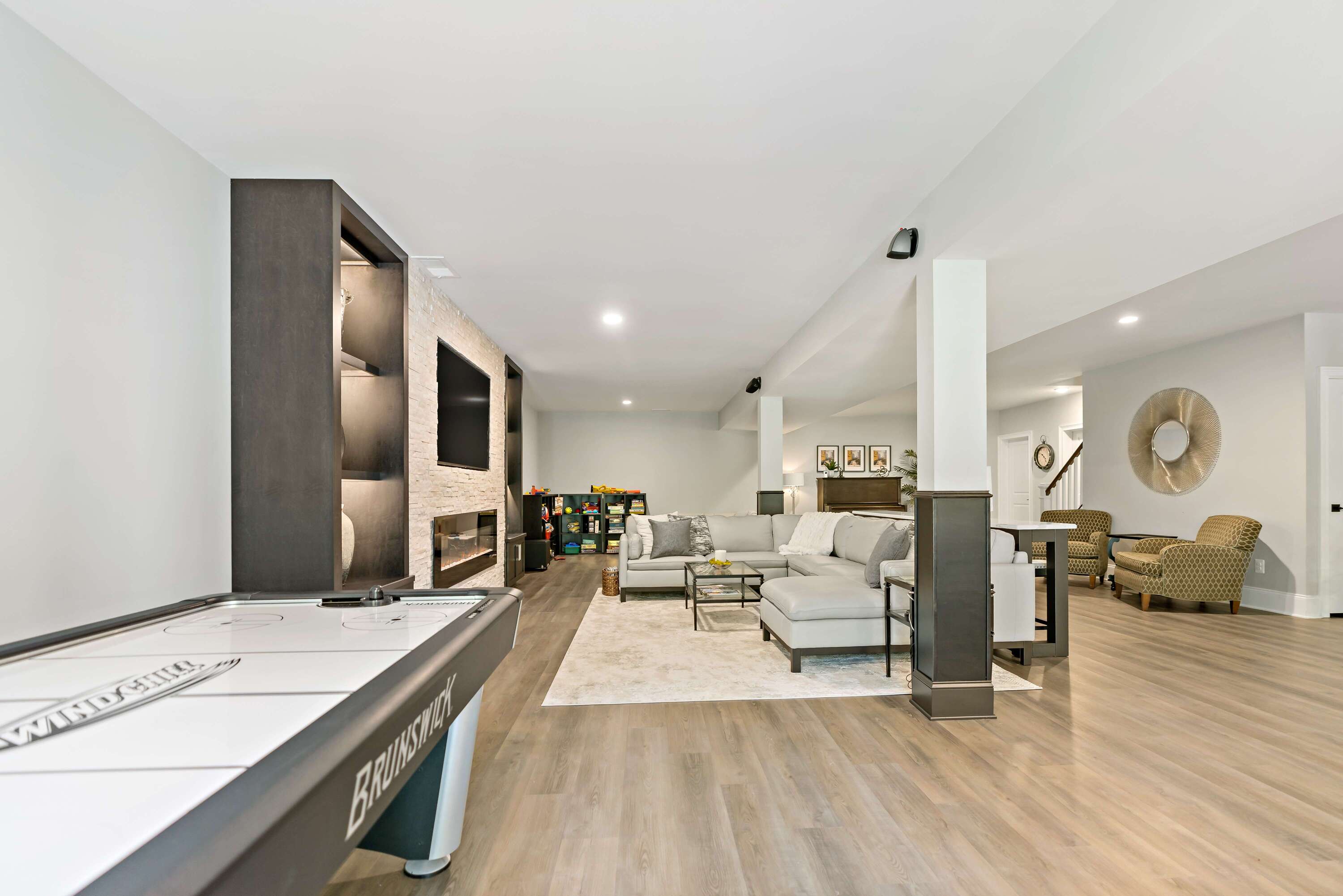 Stunning Haymarket Basement Remodel Showcases Welcoming Wet Bar and ...