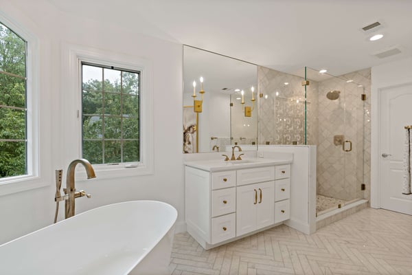 Elegant rose gold bathroom with walk-in shower and tile