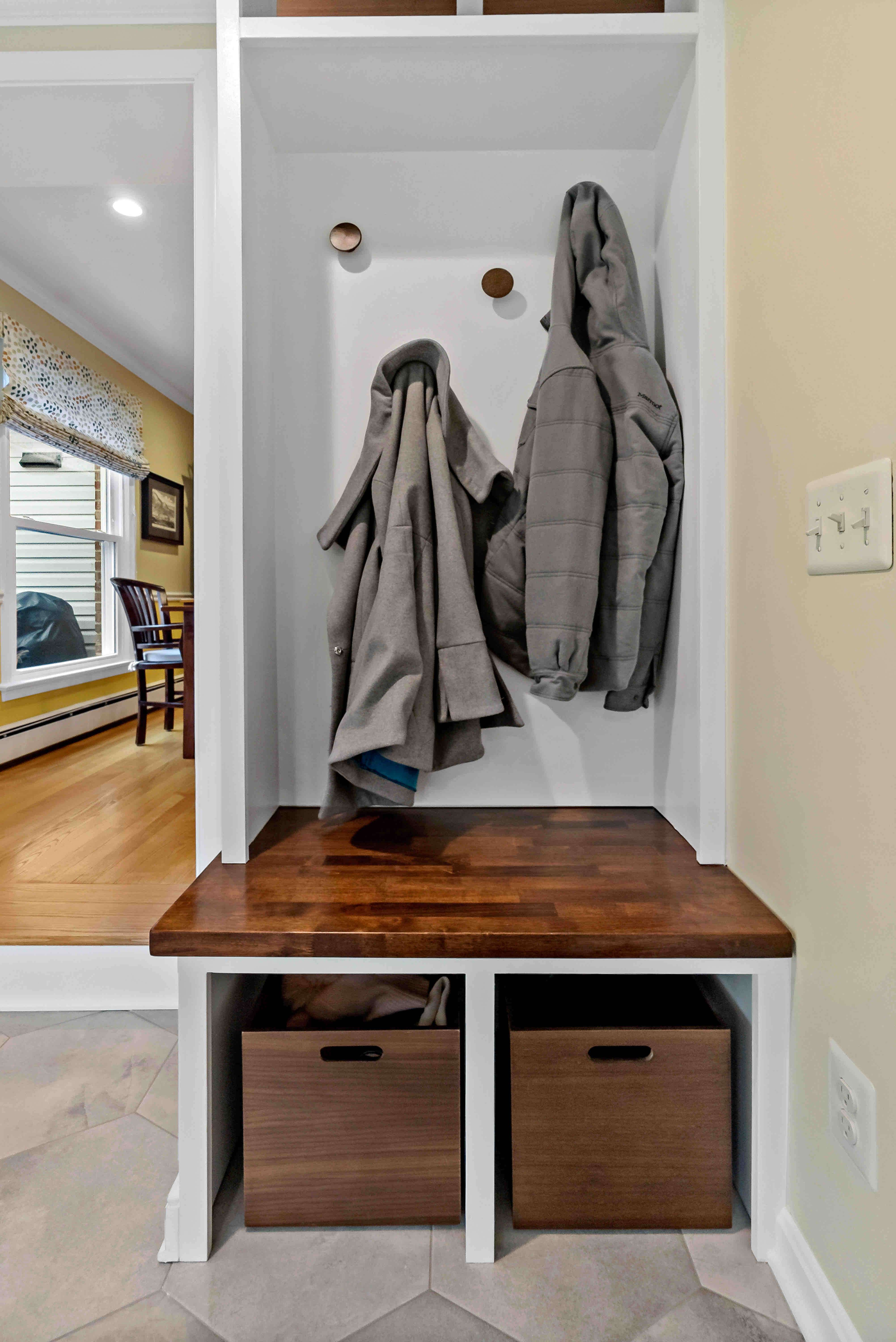 Small drop zone at entrance of house for coats and bags