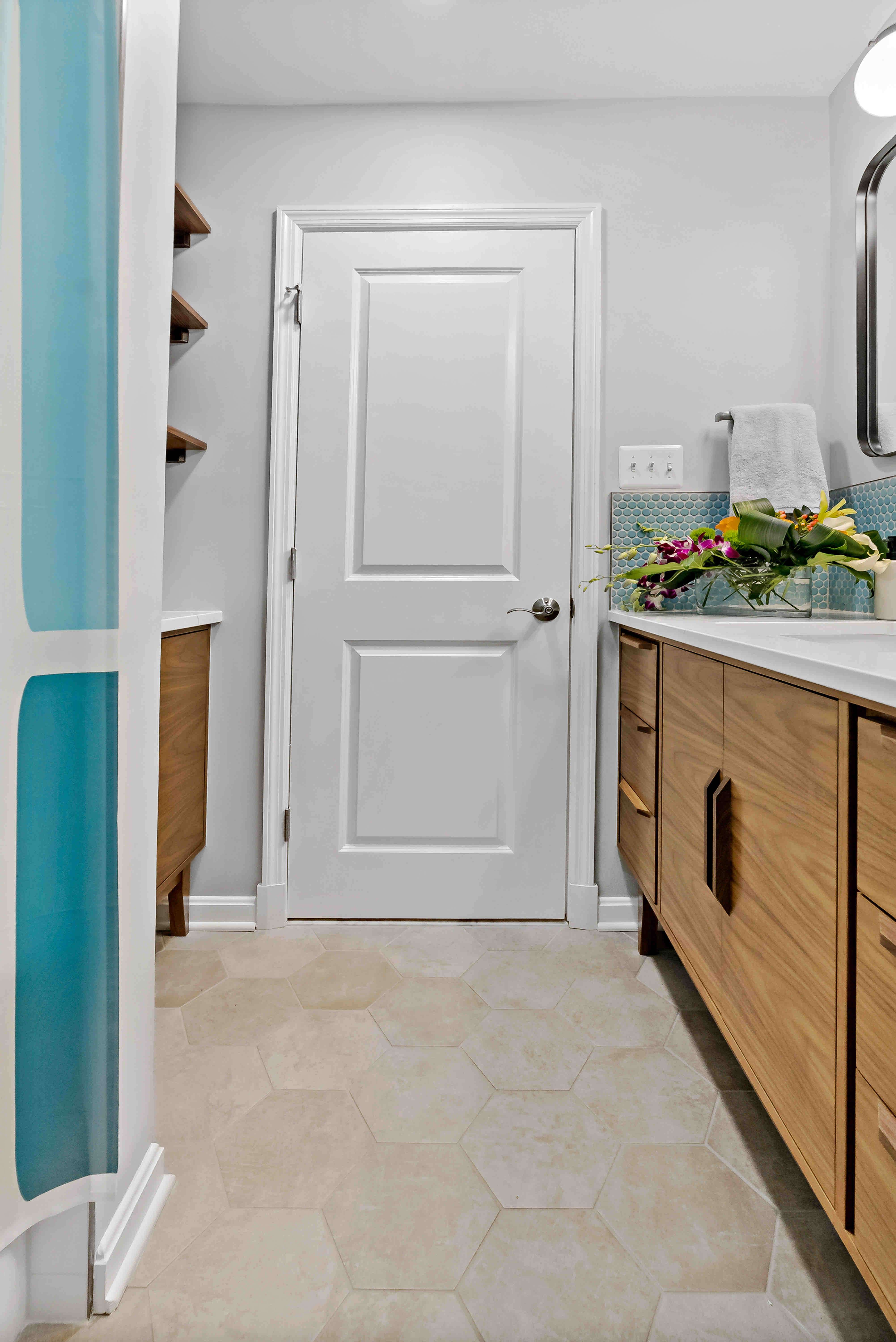 Wooden vanity with light beige floor tile