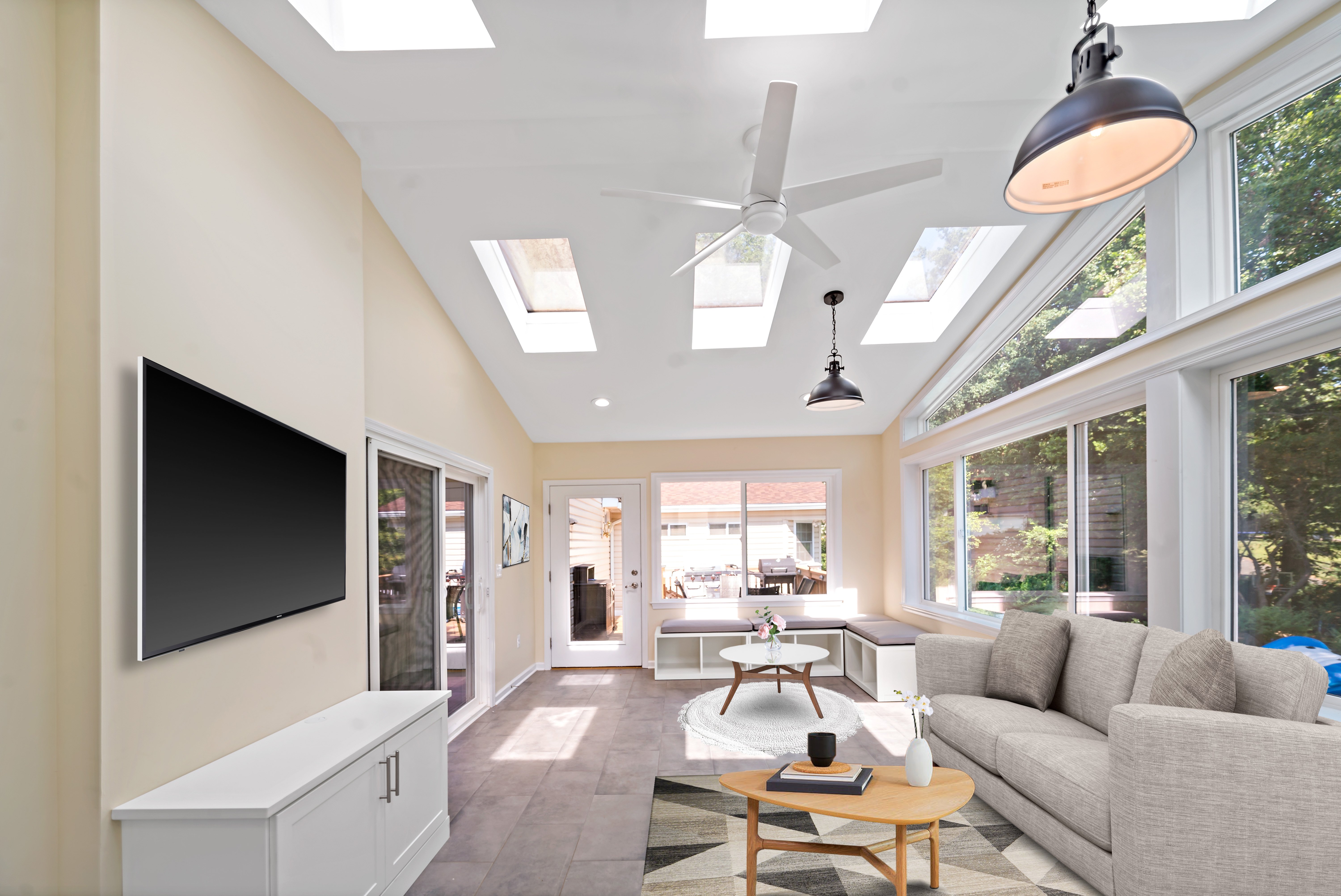 Cathedral ceiling and ceiling fan in sunroom
