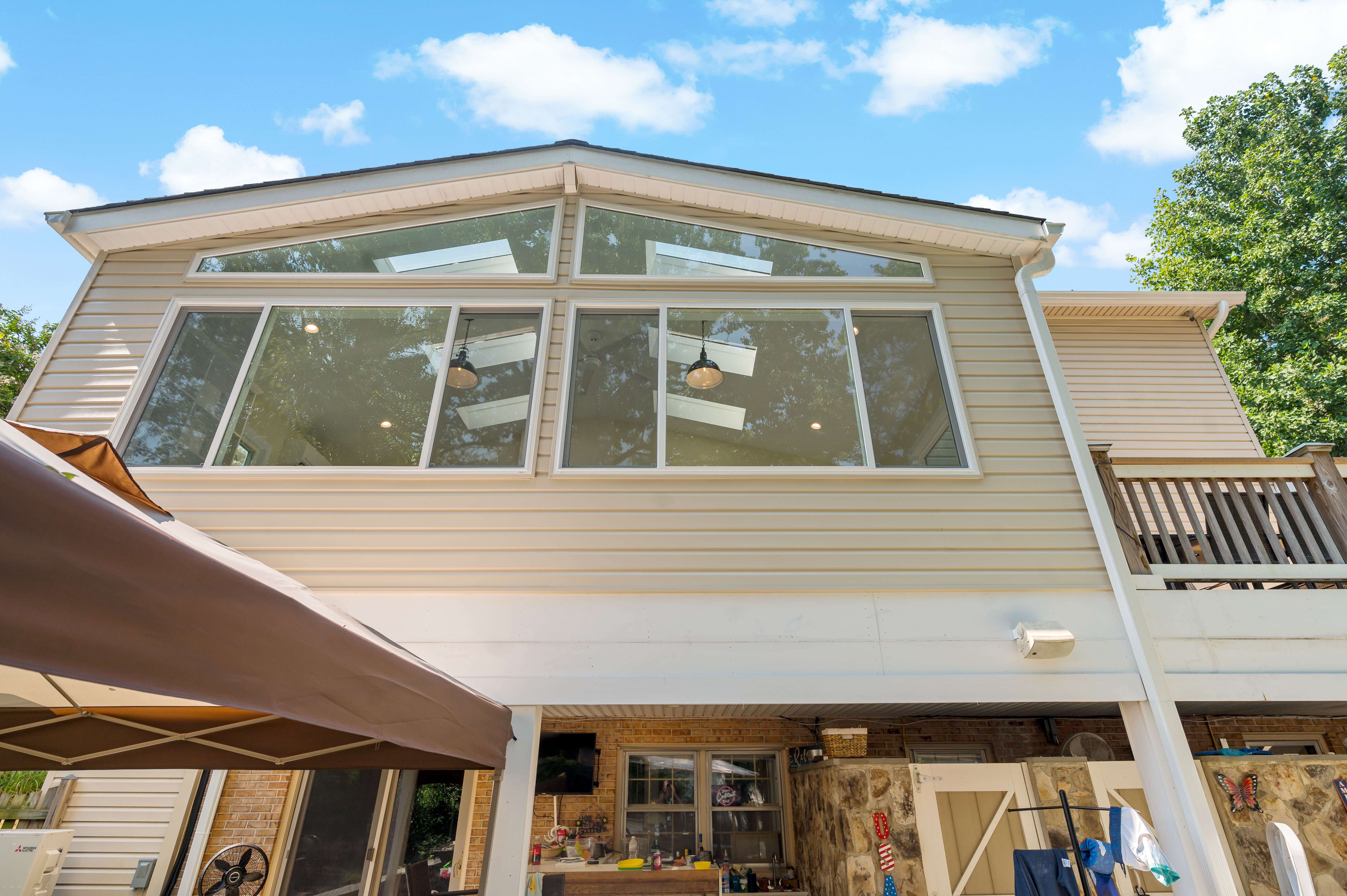 Exterior of sunroom with large windows