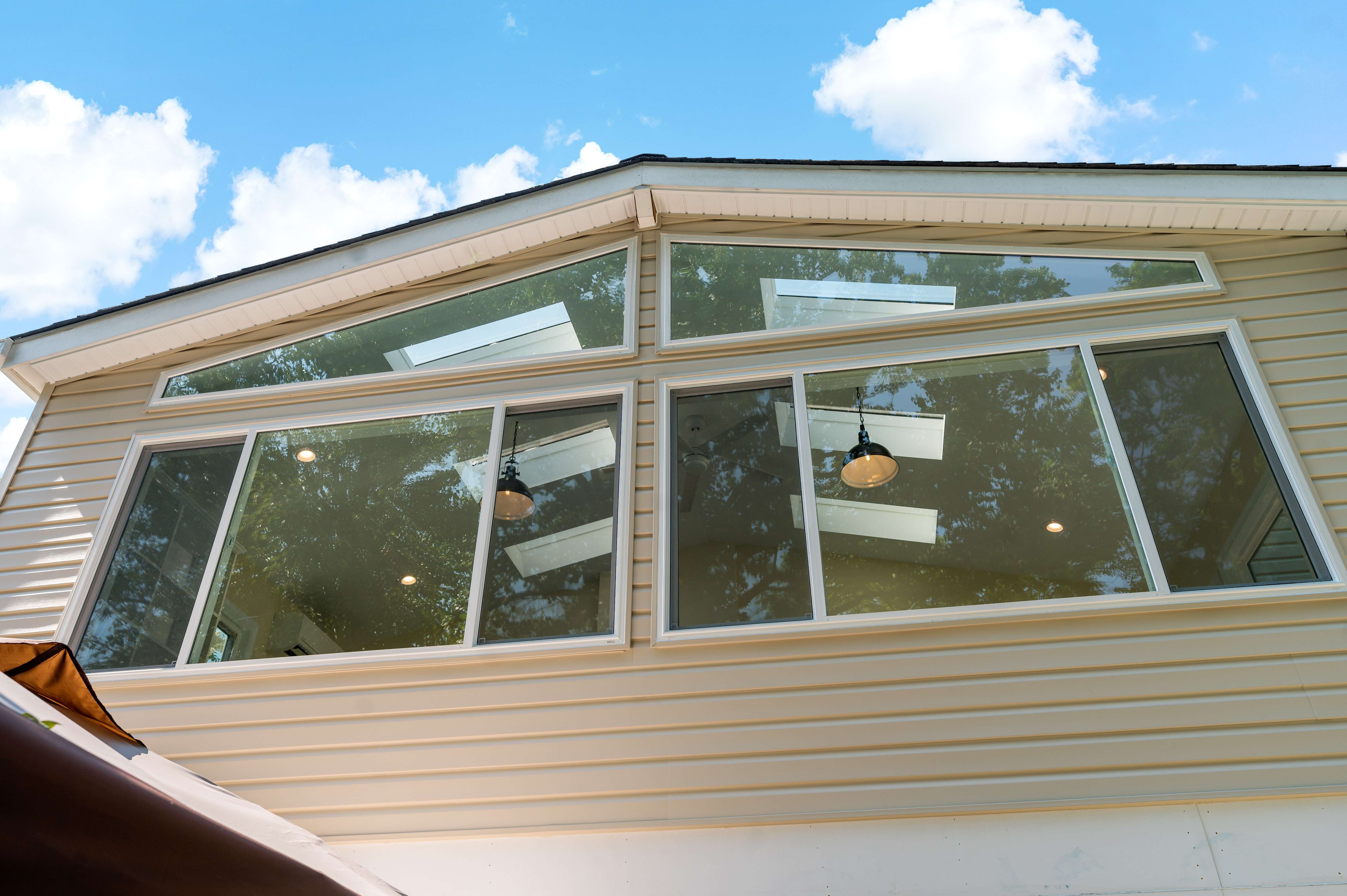 Sunroom exterior with beige paneling