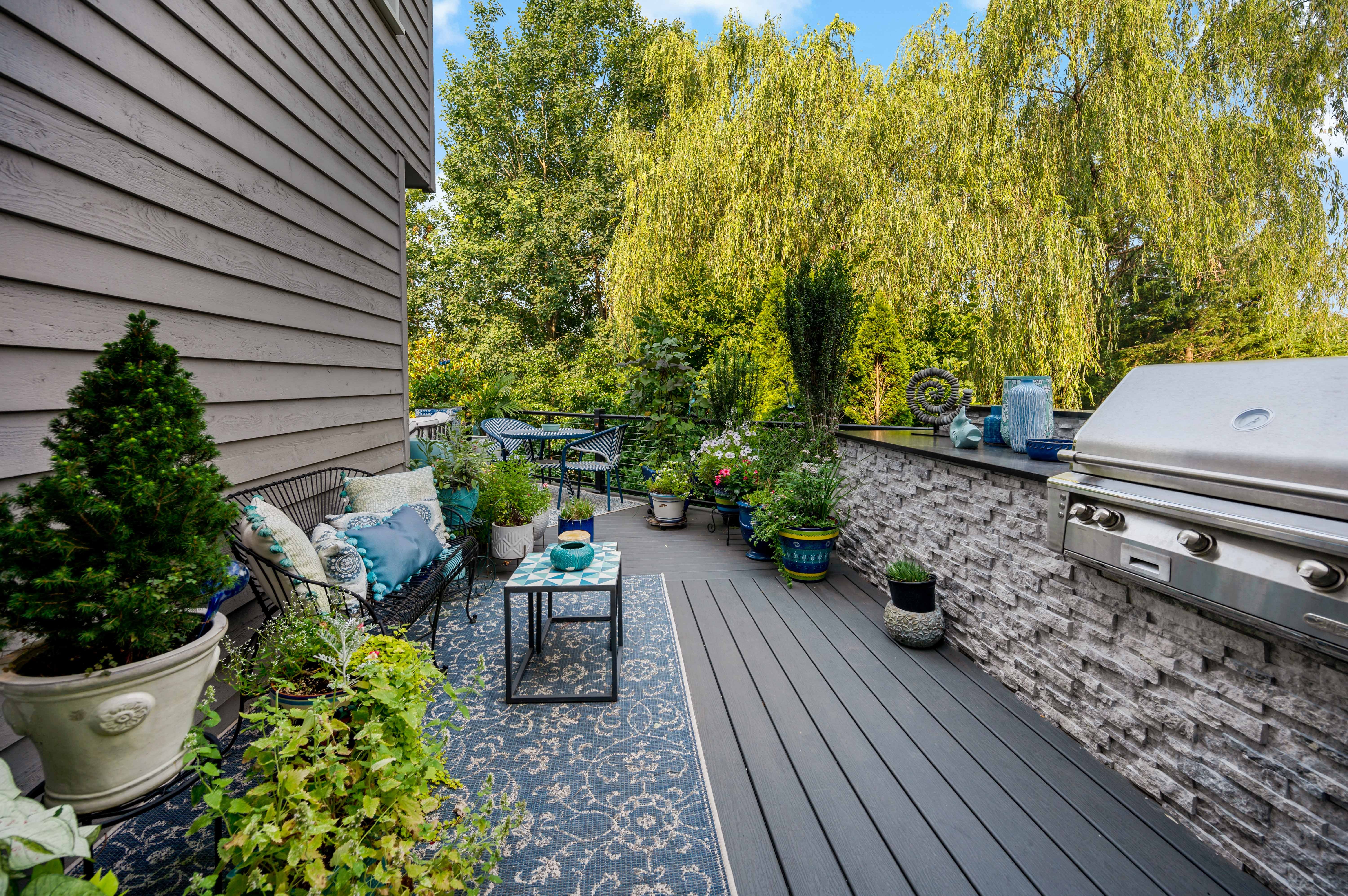 Stoned in bbq grill and grey flooring of deck