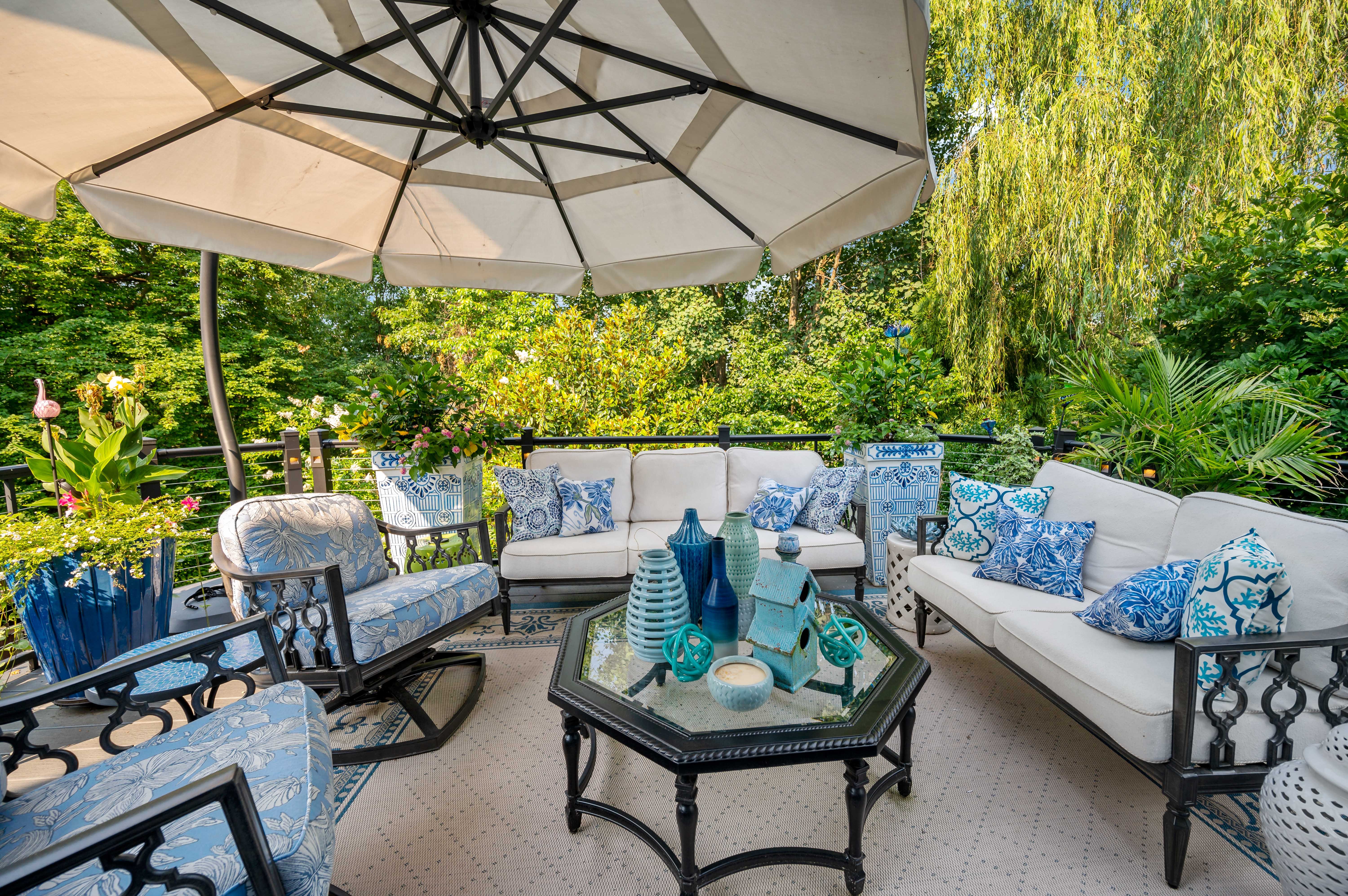 Patio furniture and umbrella on Reston deck