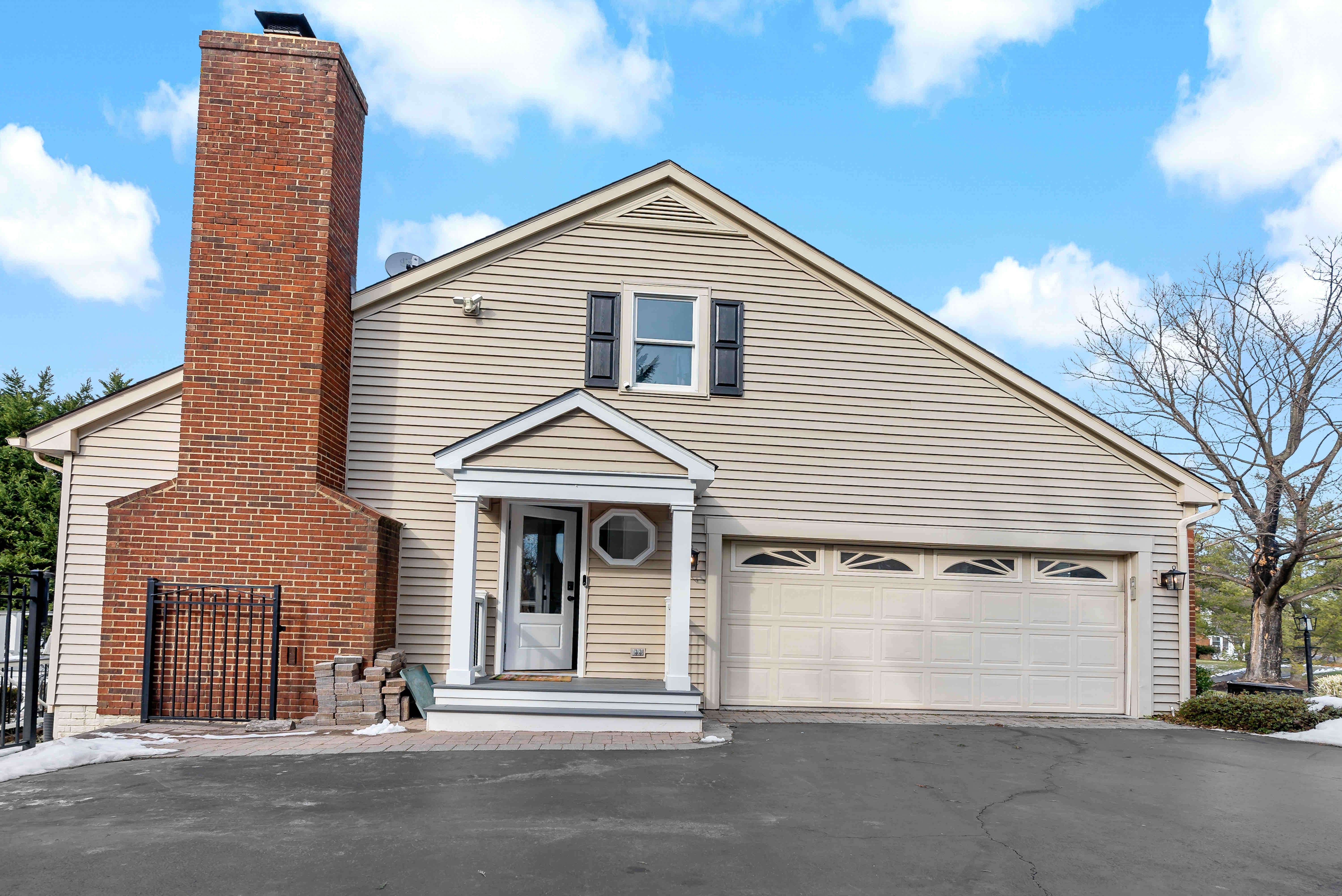 Two car garage with red brick fireplace