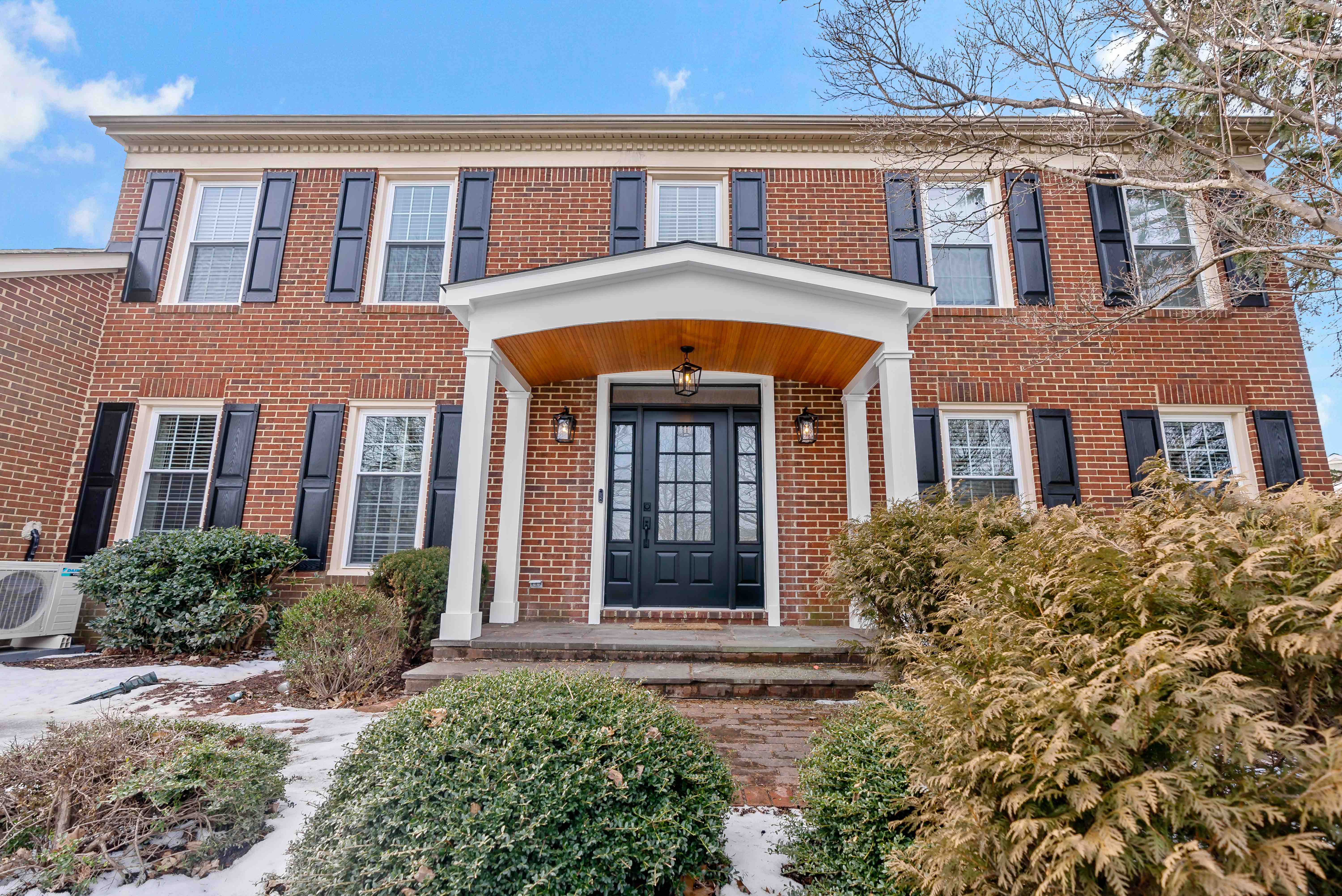 Front door of red brick house