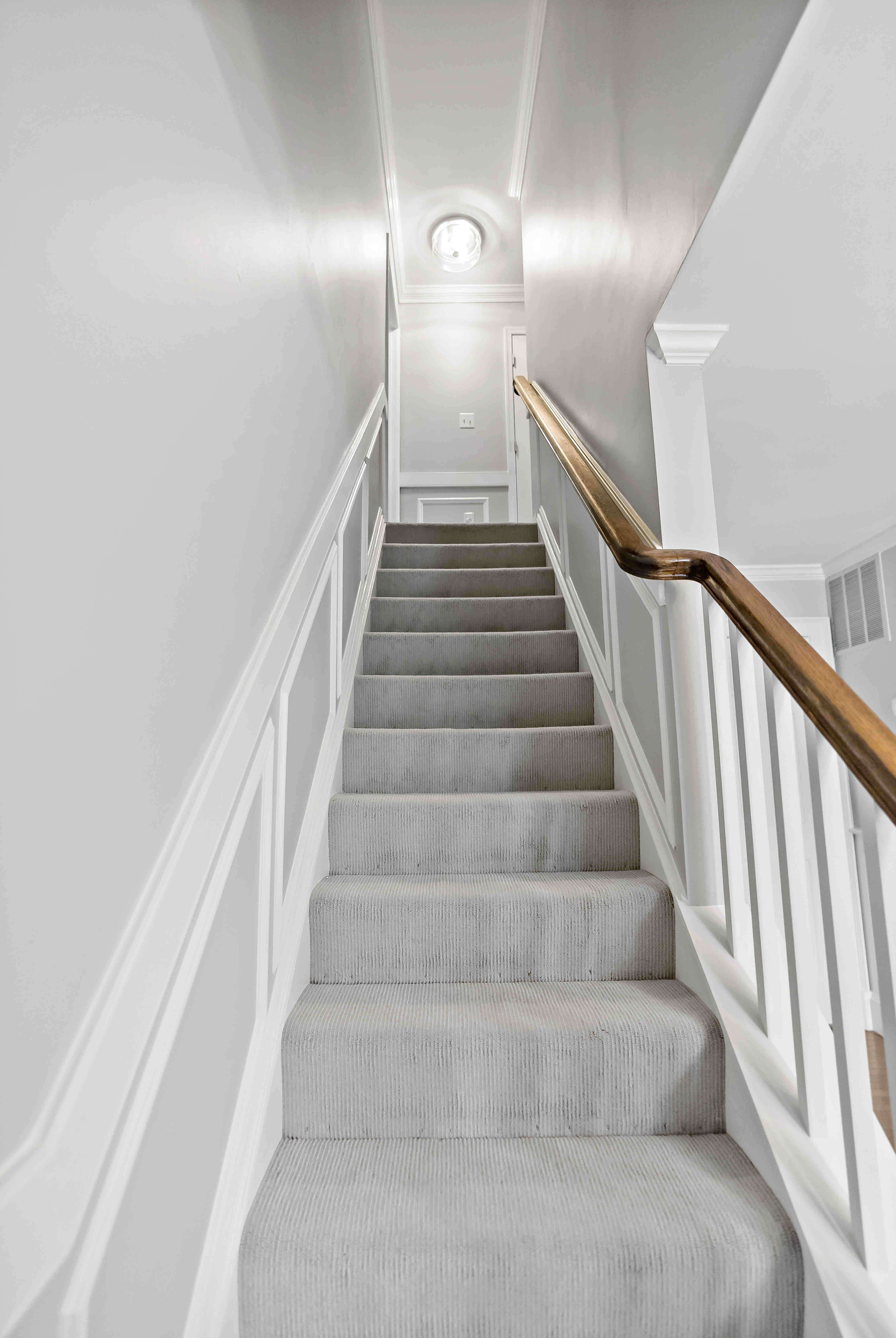 Grey carpeted floor staircase