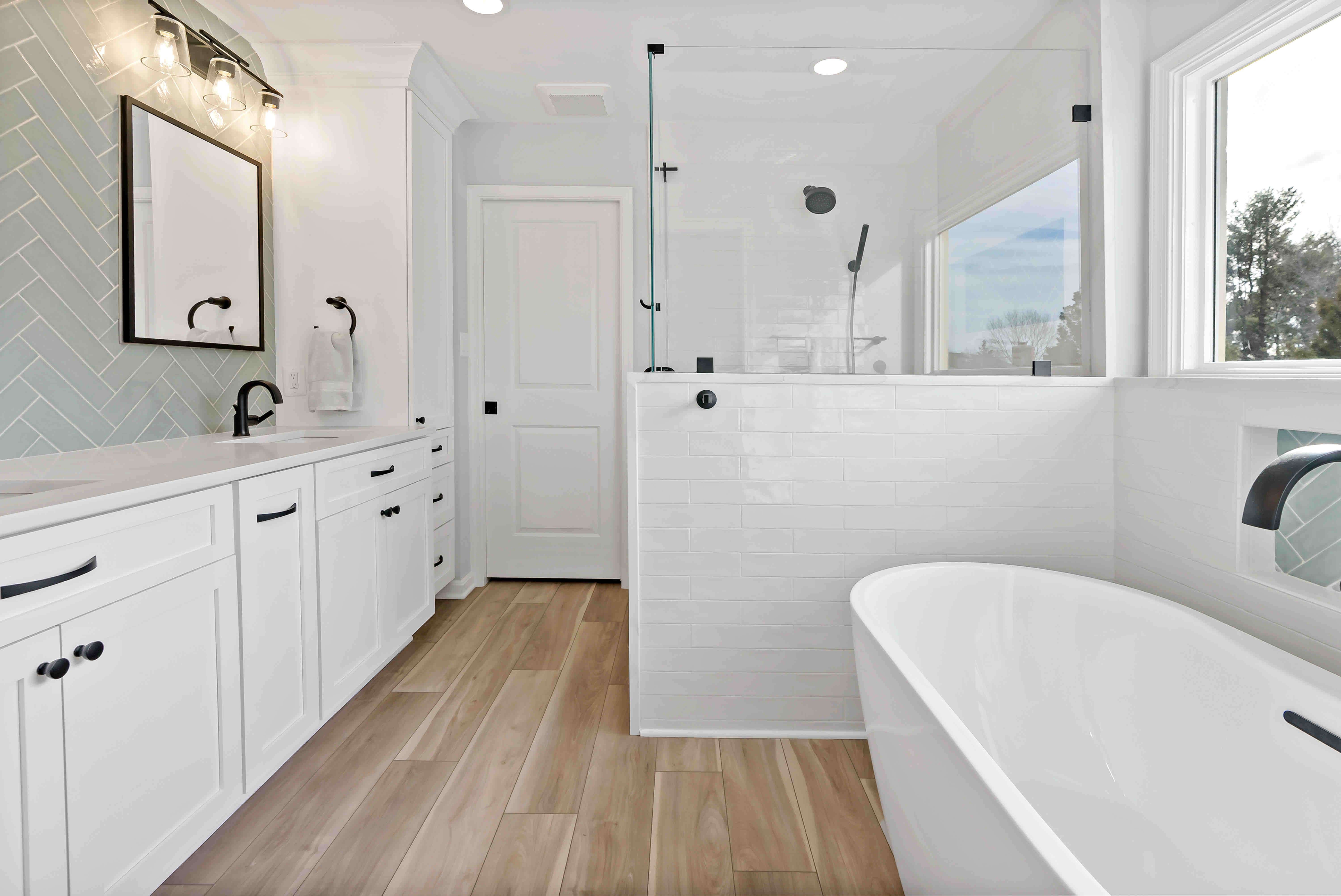 Hardwood floors in white bathroom
