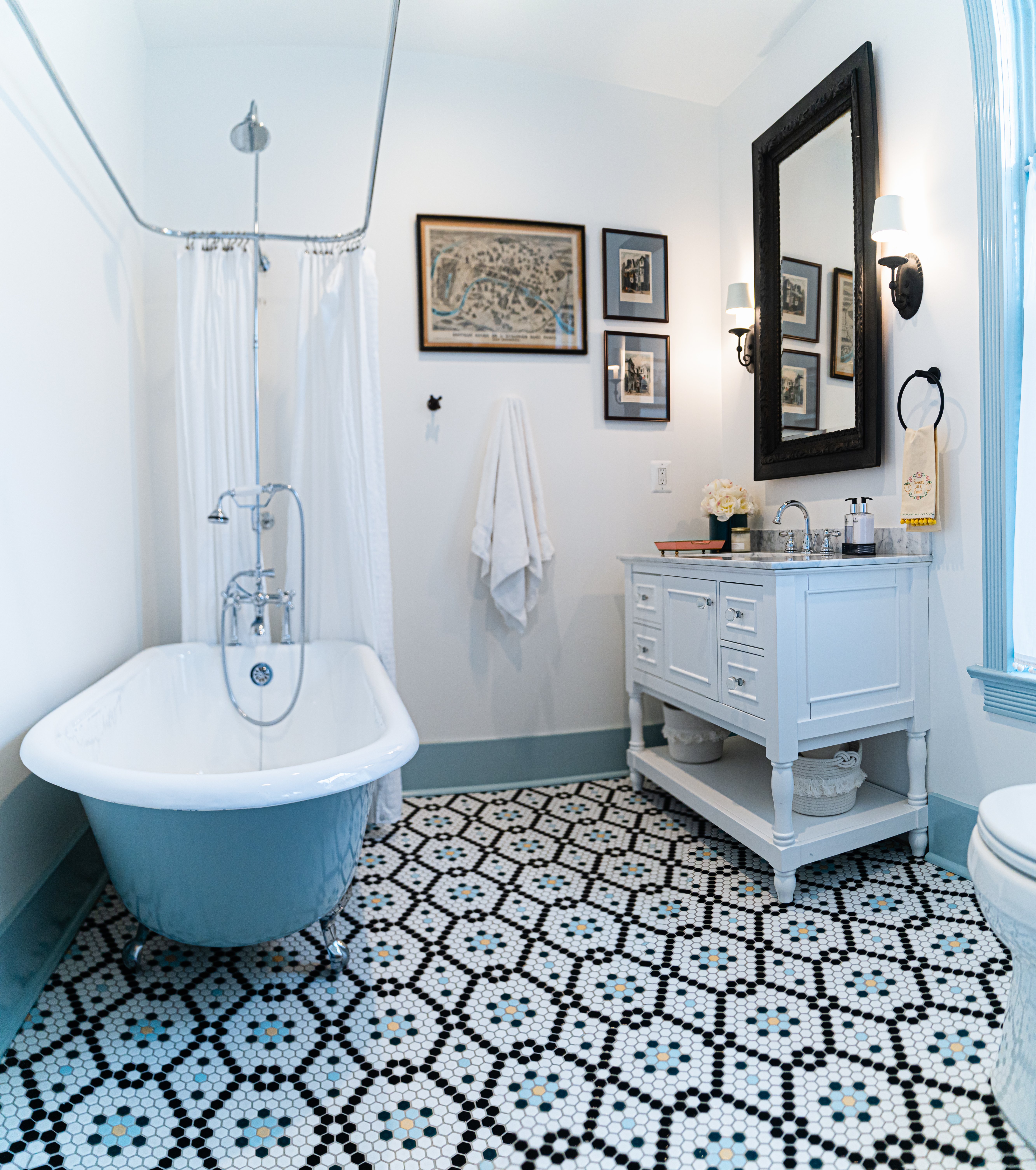 Blue bathroom with blue bathtub shower combo