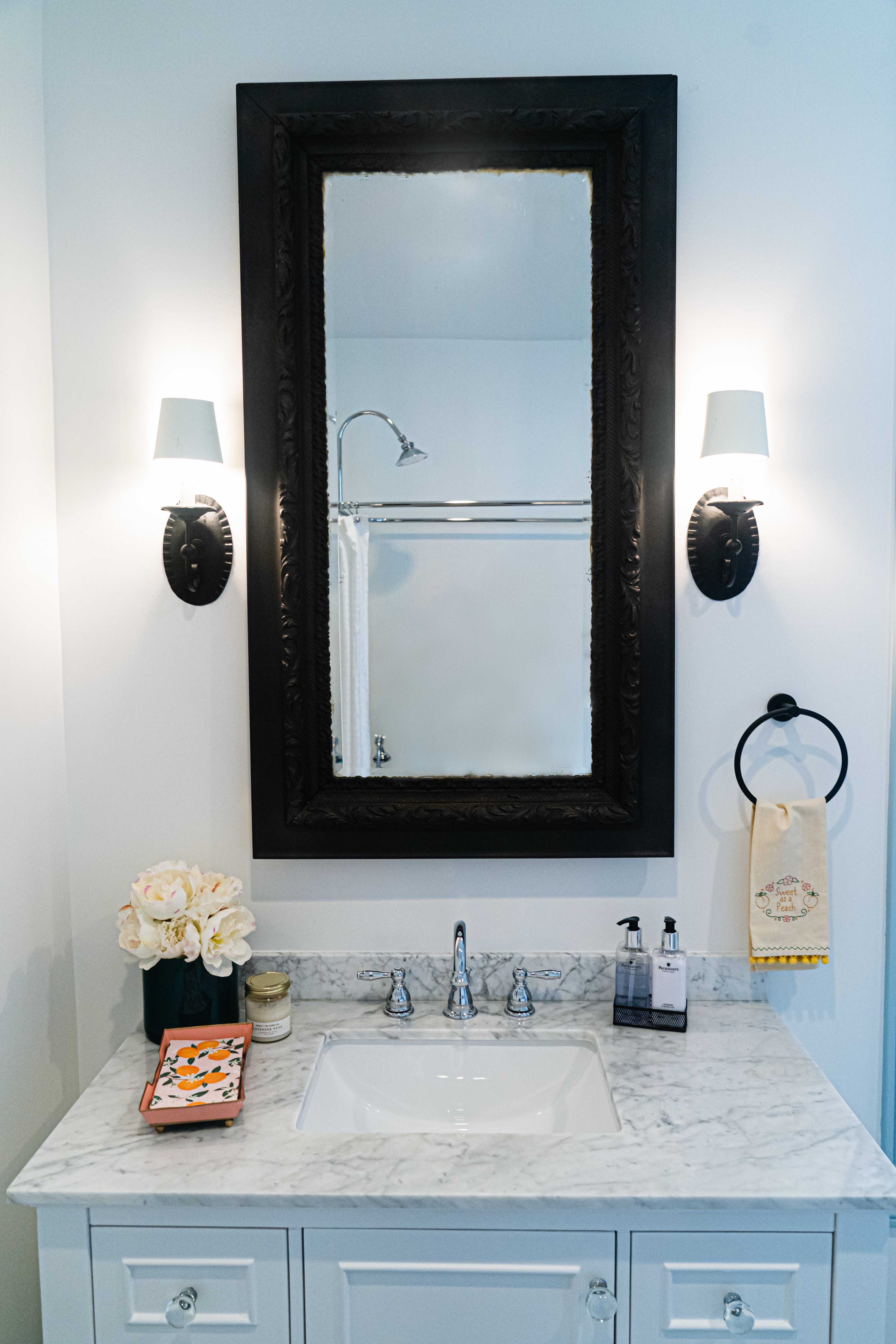 Black frame rectangular mirror in bathroom