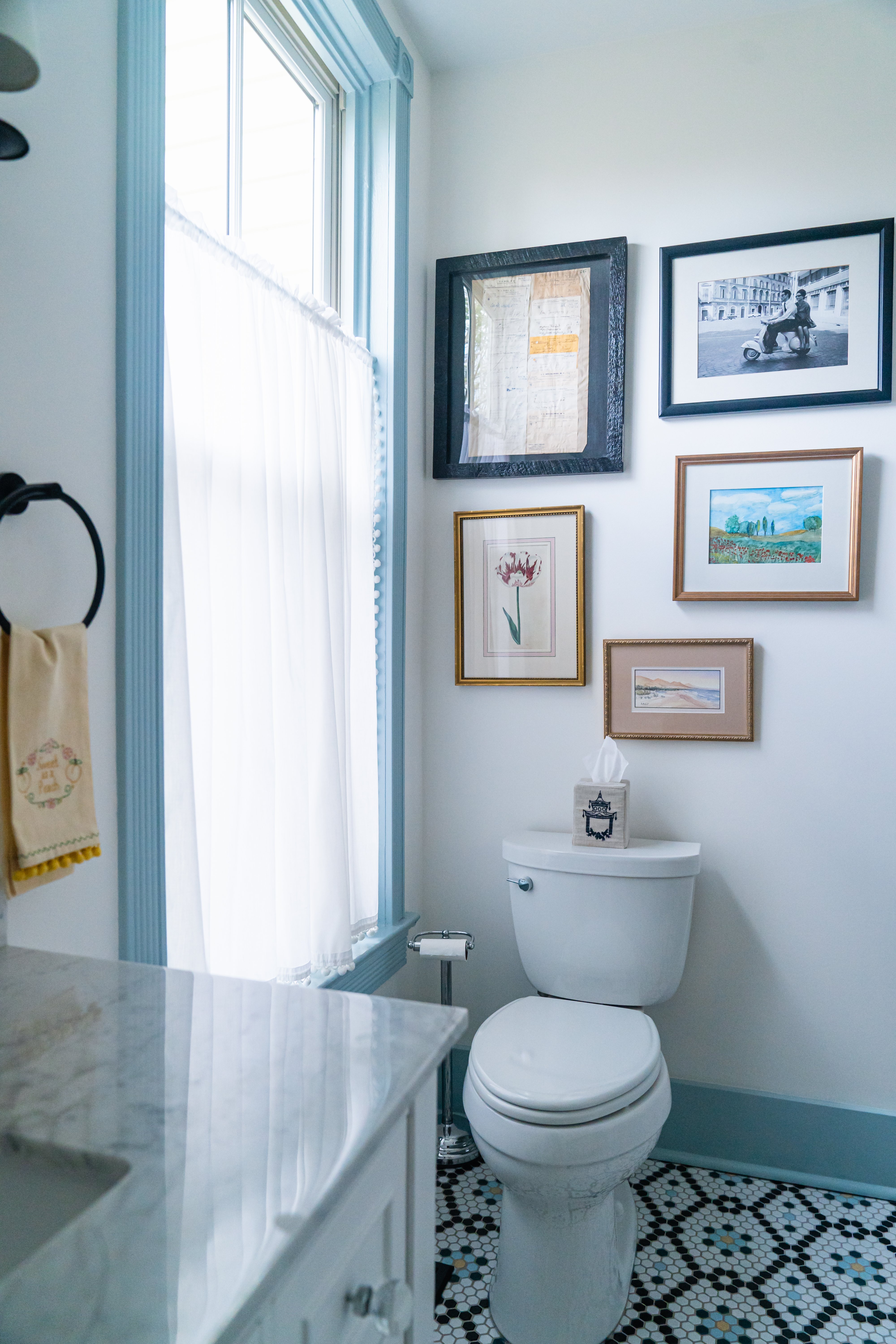 Small bathroom with blue window trim