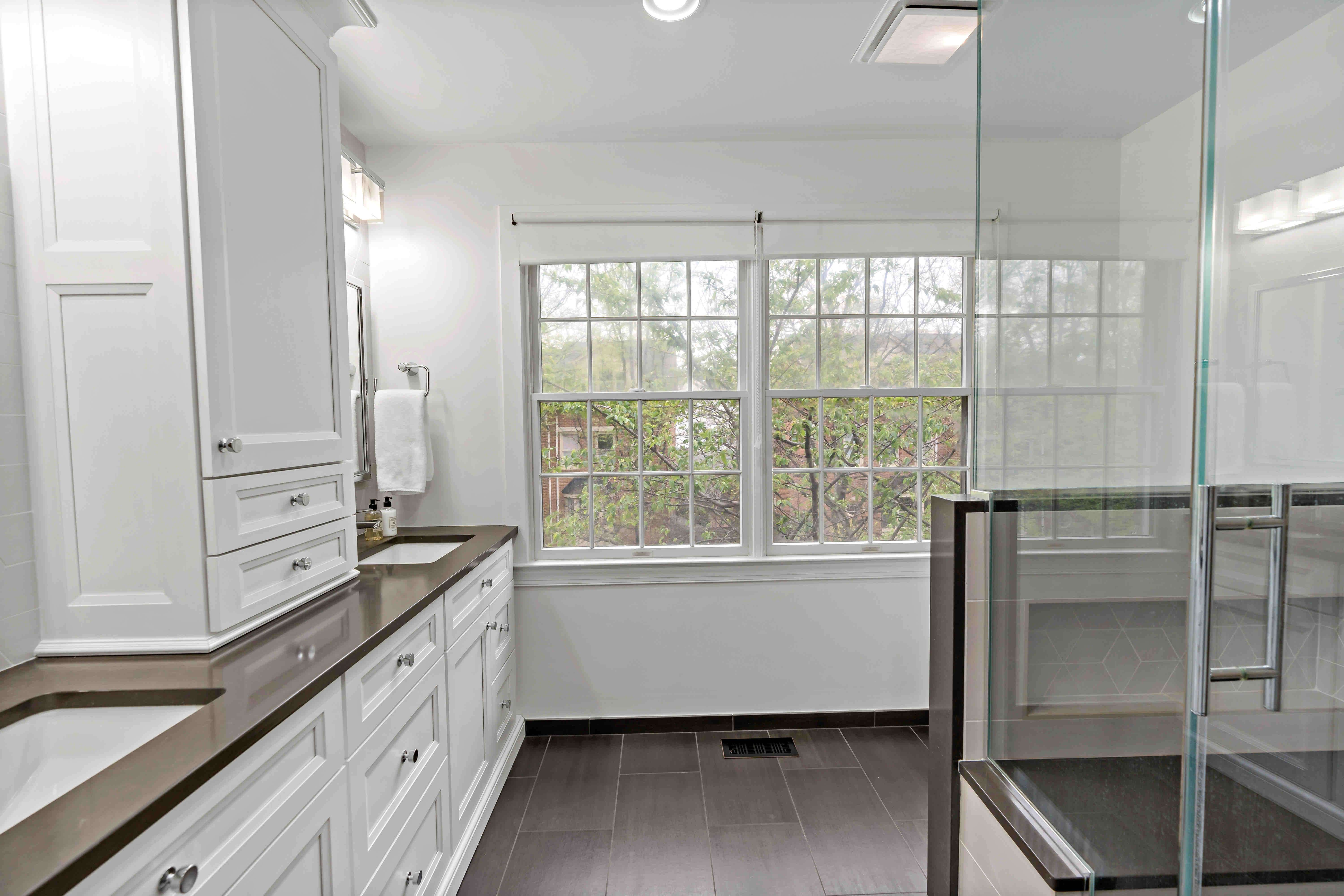 Large master bathroom with double sinks and shower with glass walls