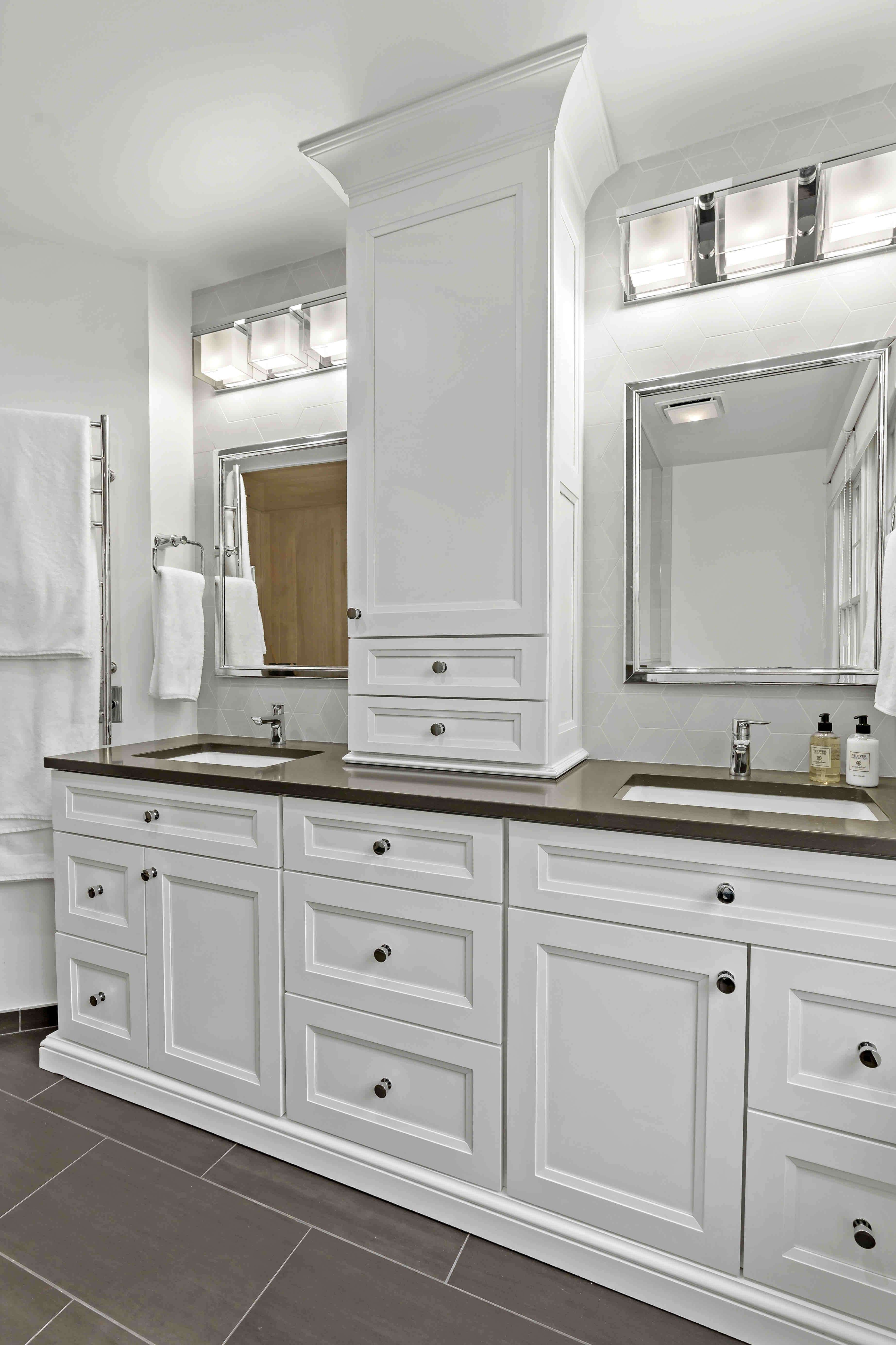 White cabinetry and double sinks with dark grey countertops in Arlington bathroom