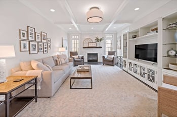 Neutral colored living room with coffered ceiling