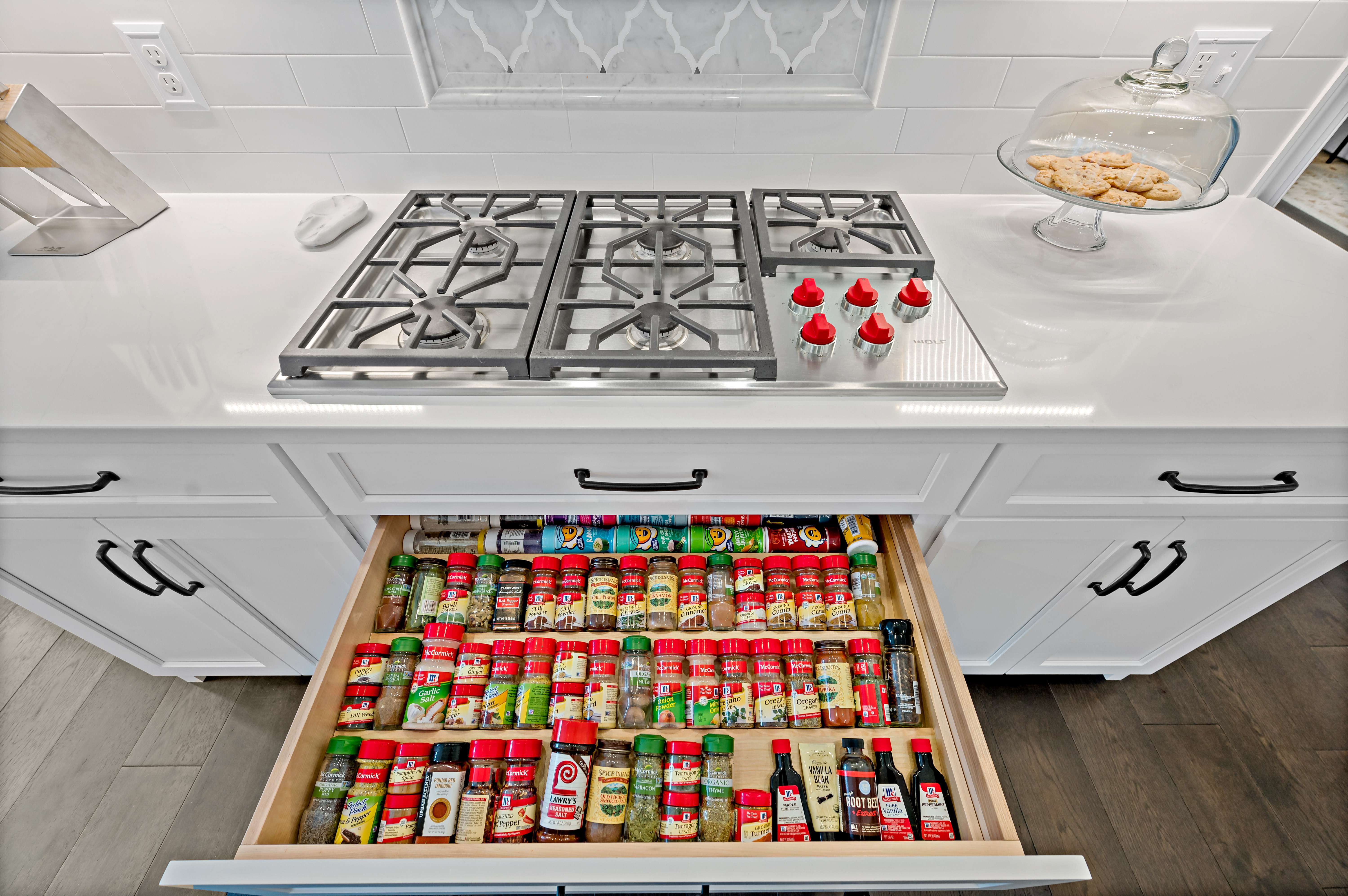 Custom kitchen cabinetry for spices organization near stove