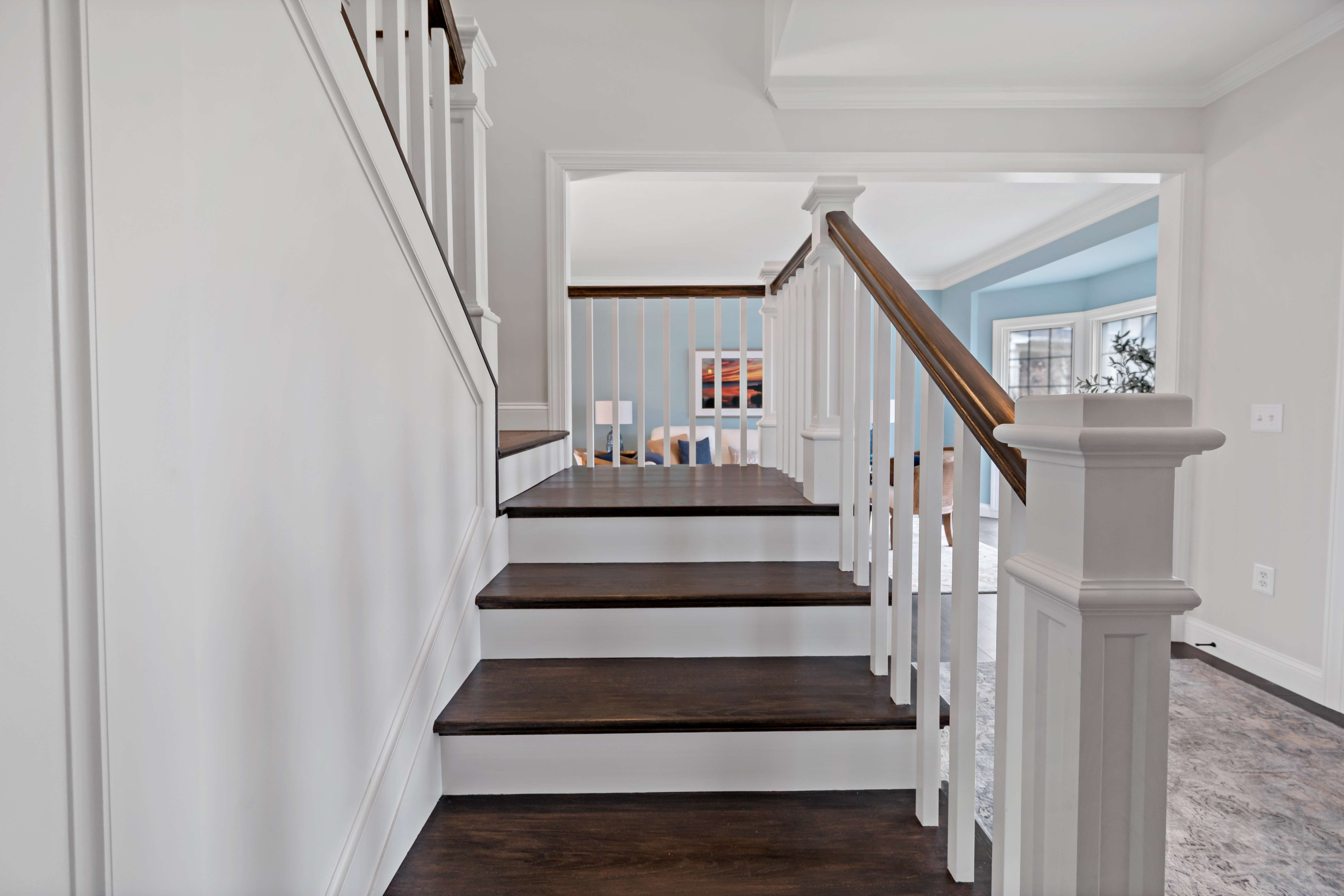 Wood steps on white stairs