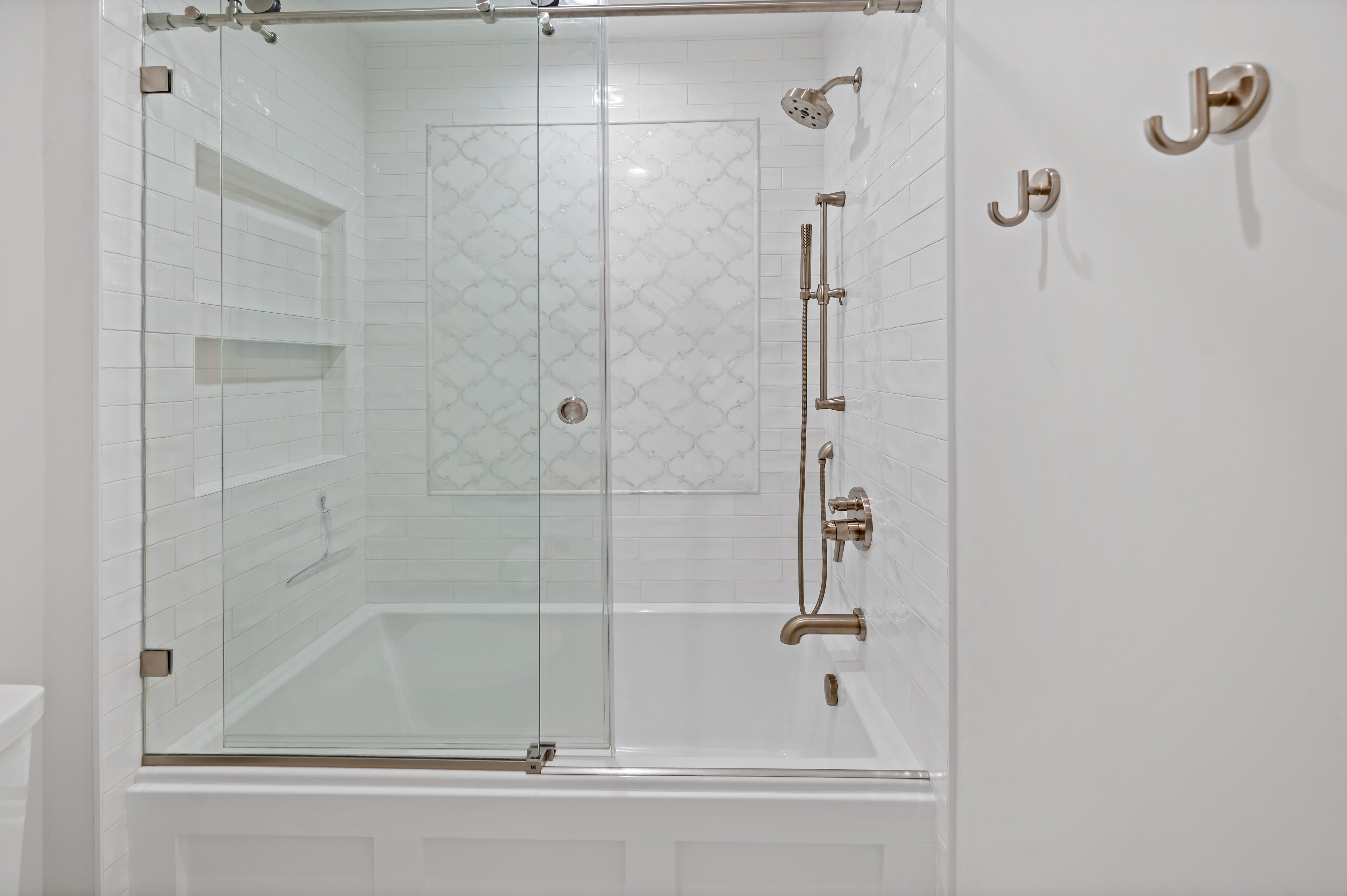 Bathtub shower combo with gold fixtures