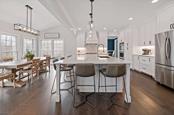 Dining Lighting with large kitchen island and seating around