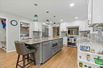 Grey and white traditional kitchen remodel with kitchen island seating