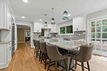 Kitchen island seating with grey chairs that have rhinestone accents
