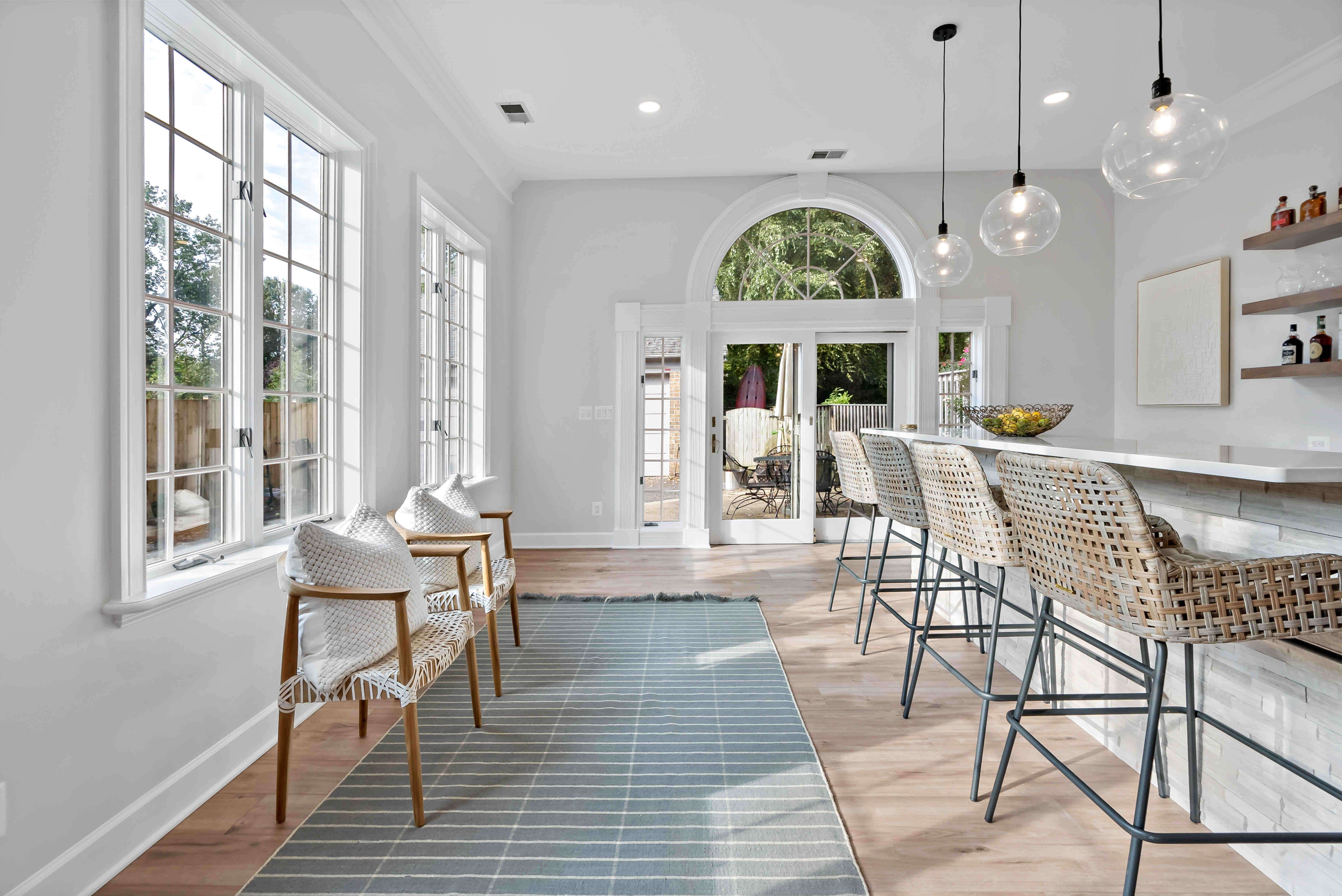 White panel windows in home bar area for natural lighting